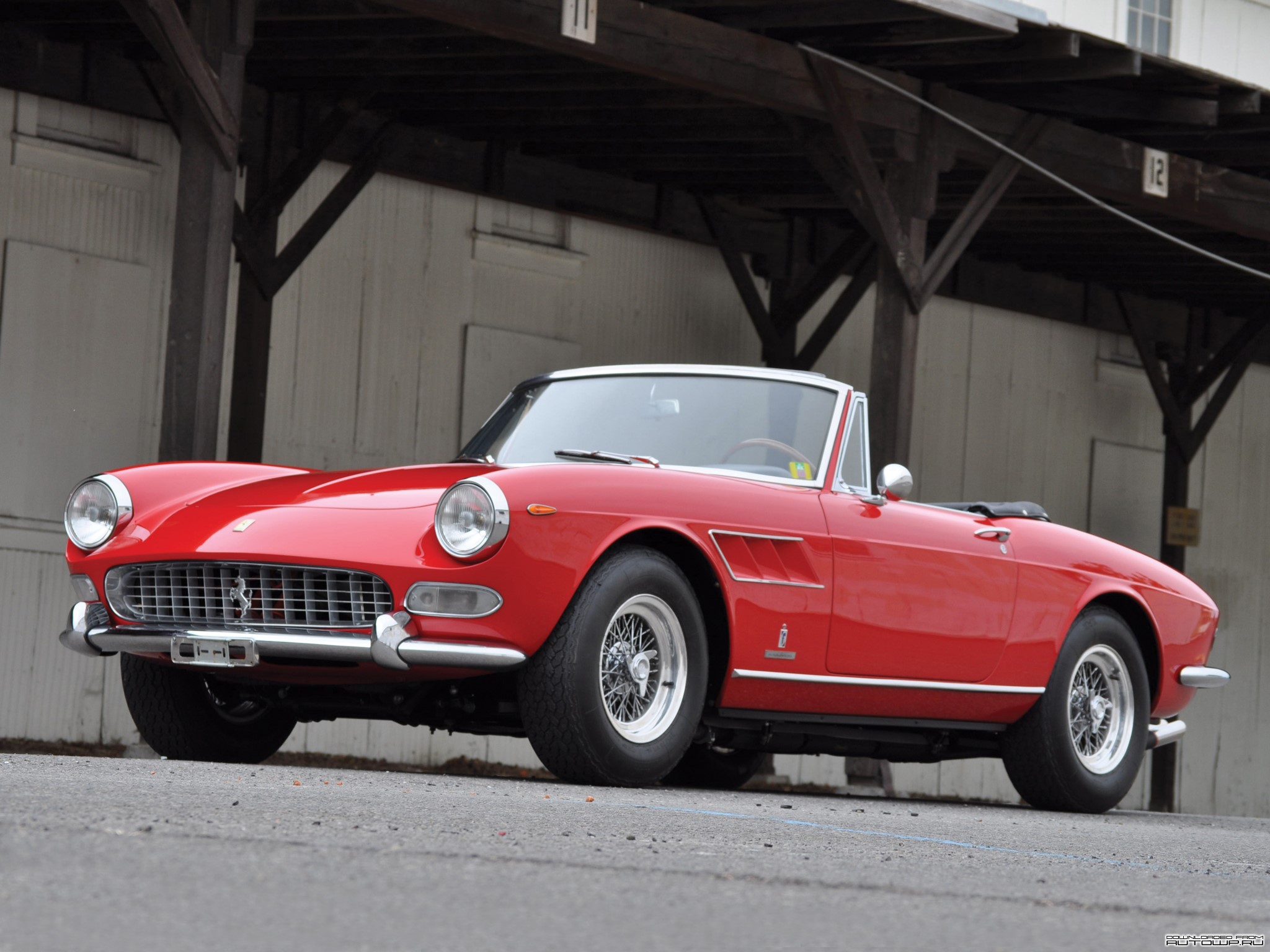 Red Ferrari Convertible parked outdoors HD Wallpaper