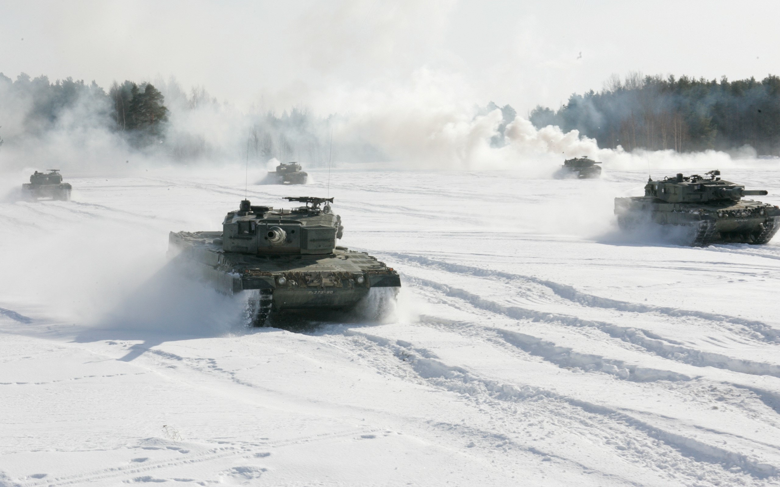 Tanks driving through snow with smoke HD Wallpaper