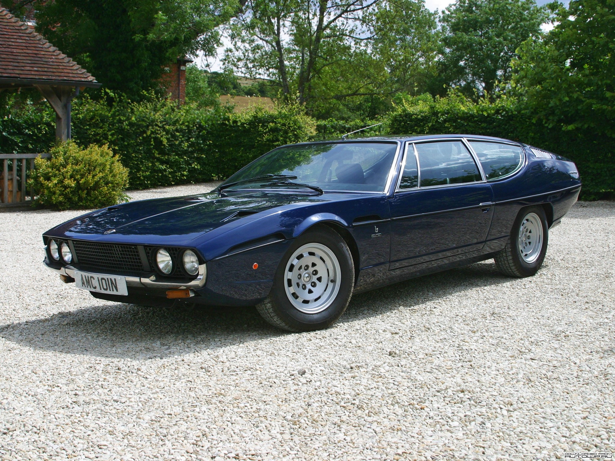 Dark Blue Lamborghini Espada parked on gravel HD Wallpaper