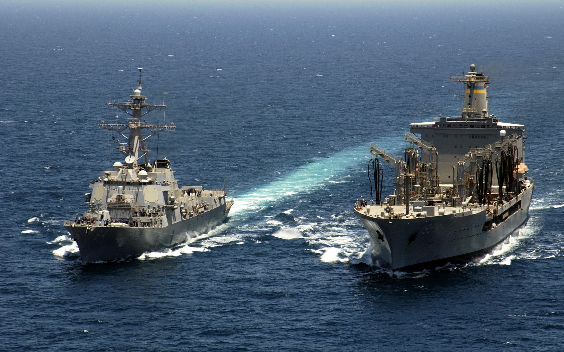 US Navy ships refueling at sea HD Wallpaper