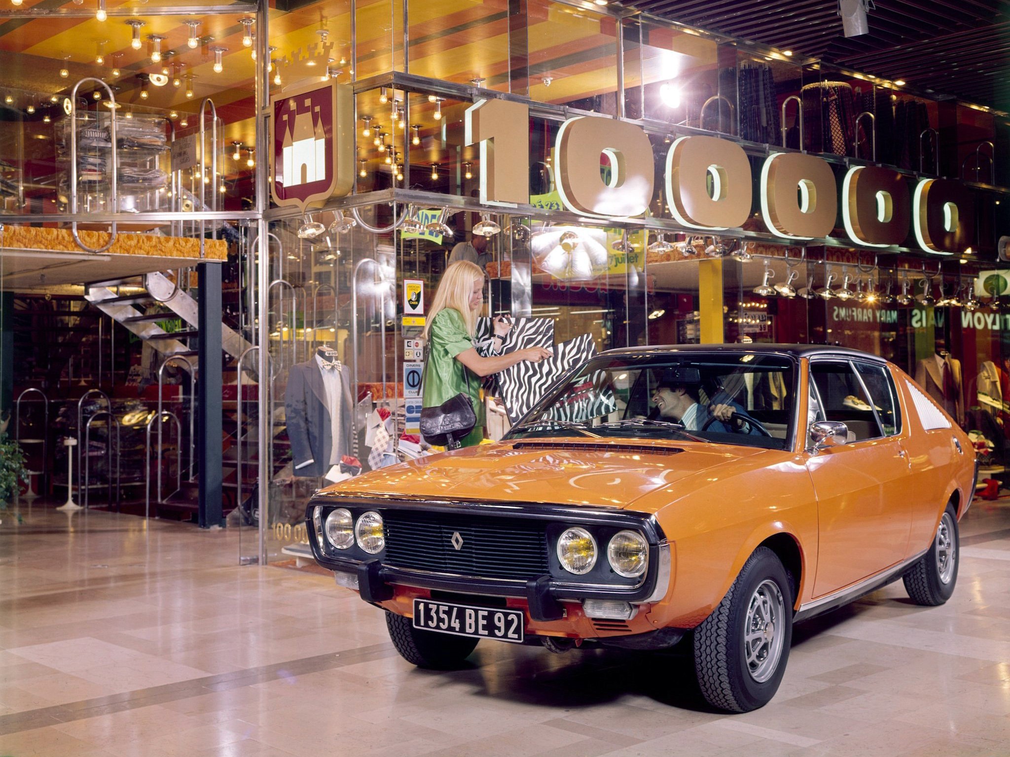 Orange Renault car in a shopping mall HD Wallpaper