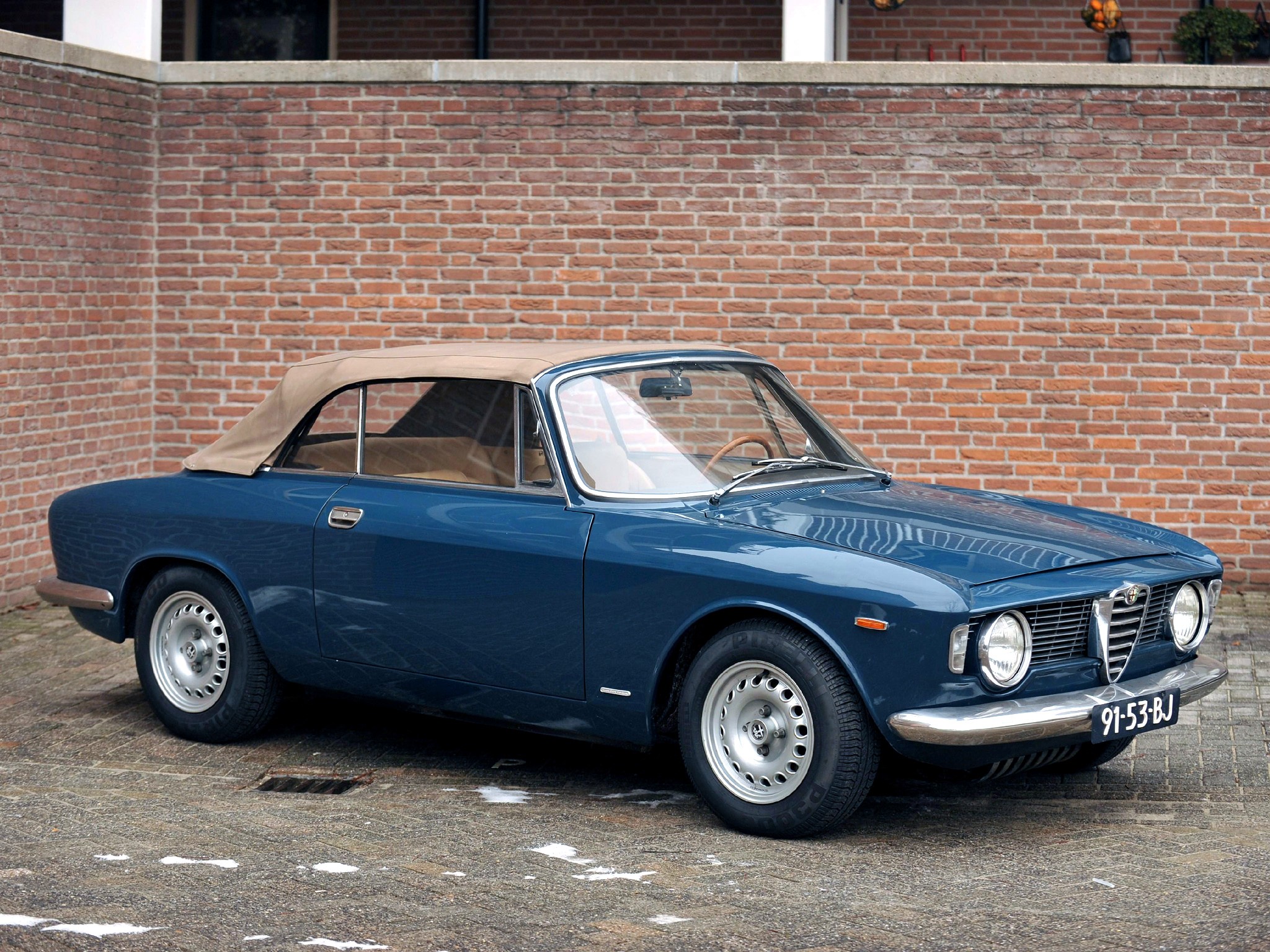 Blue Alfa Romeo Convertible with Tan Top HD Wallpaper