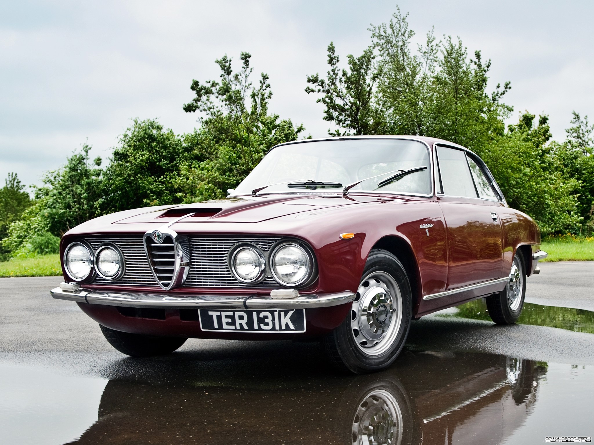 Maroon Alfa Romeo coupe on a wet road HD Wallpaper