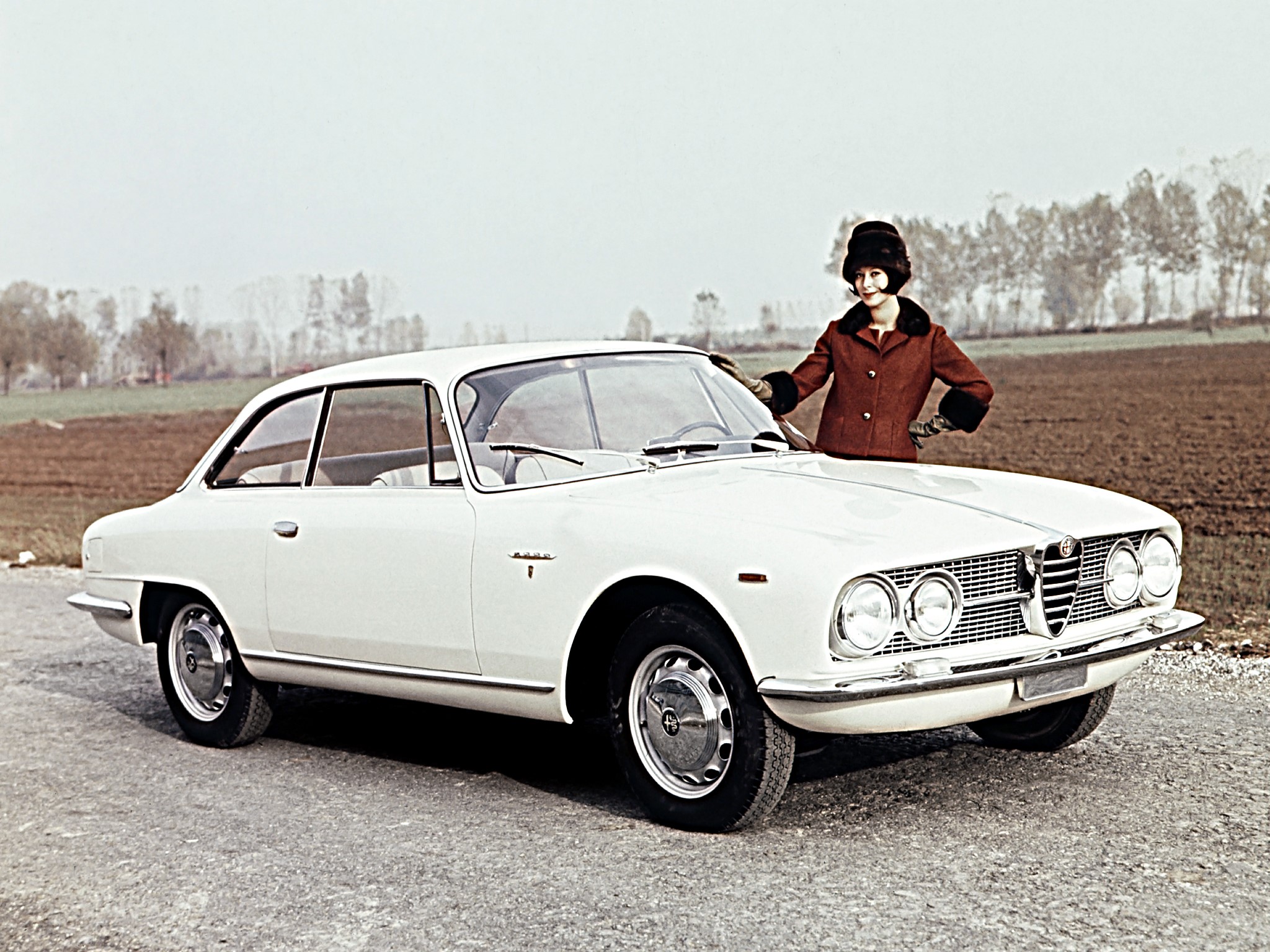 Woman posing with a white Alfa Romeo car HD Wallpaper