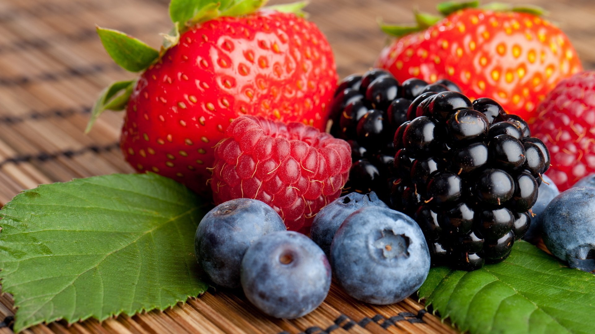 Assortment of fresh berries including strawberries, blackberries, raspberries, and blueberries HD Wallpaper
