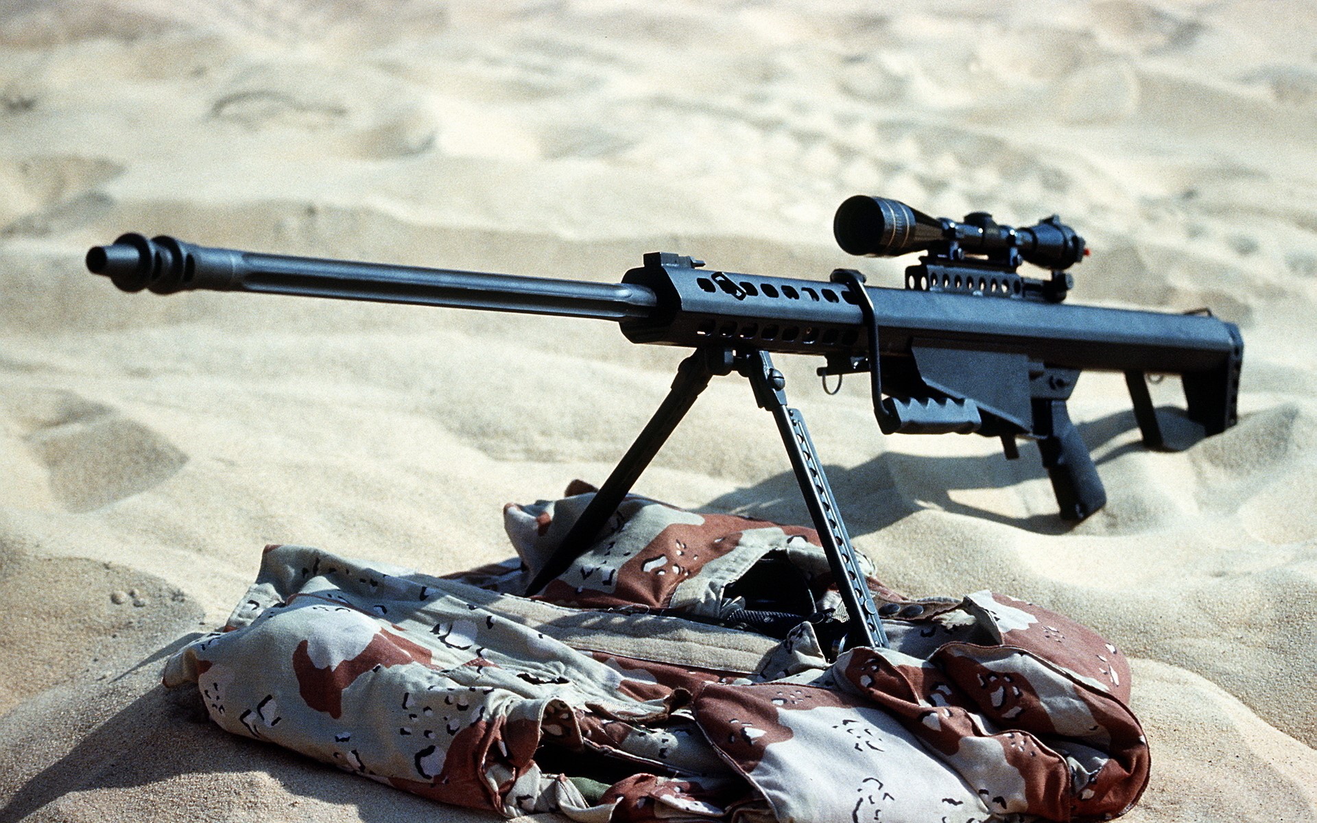 Sniper rifle with telescopic sight on sand HD Wallpaper