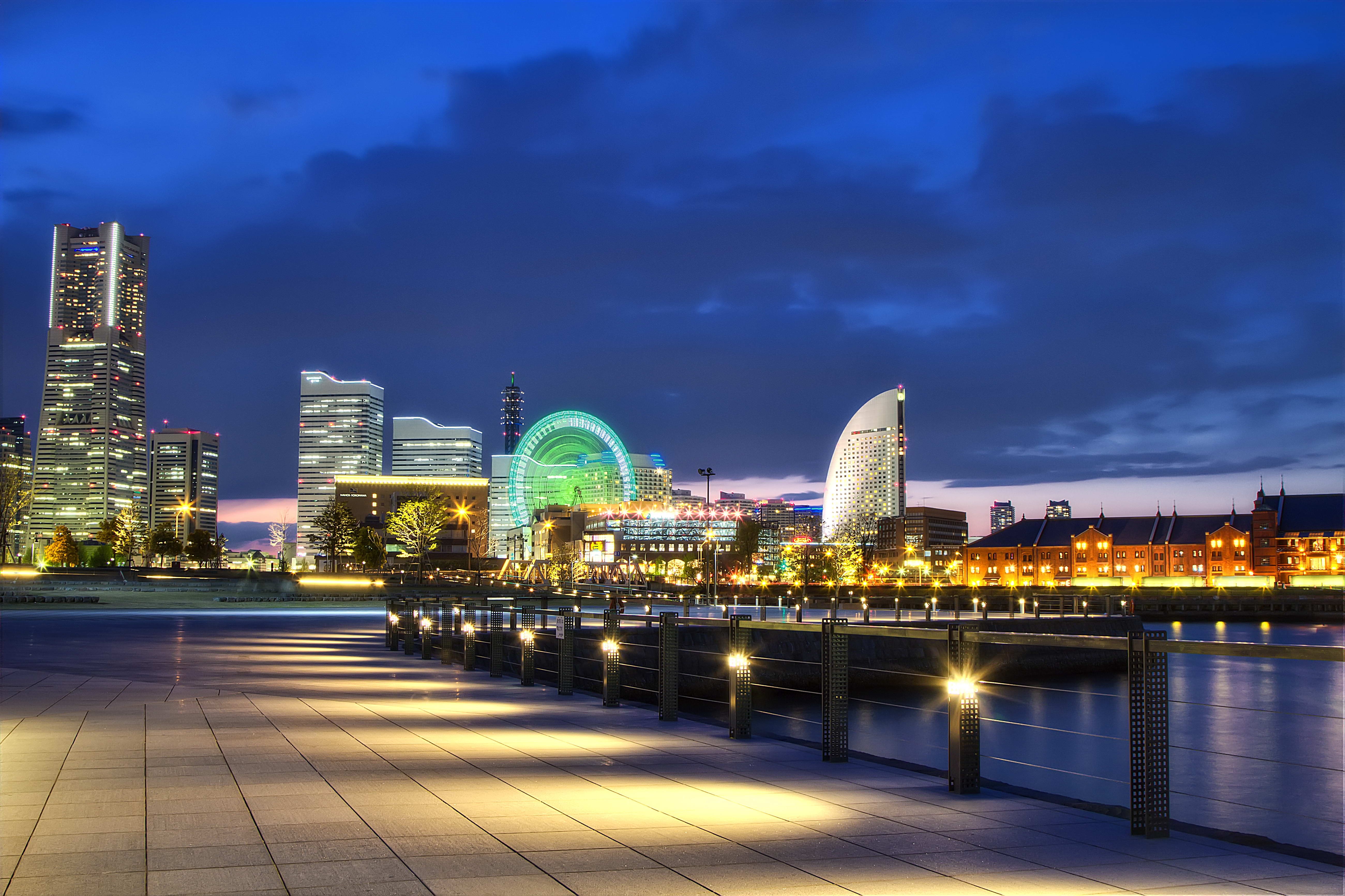 Yokohama skyline at night with waterfront promenade HD Wallpaper
