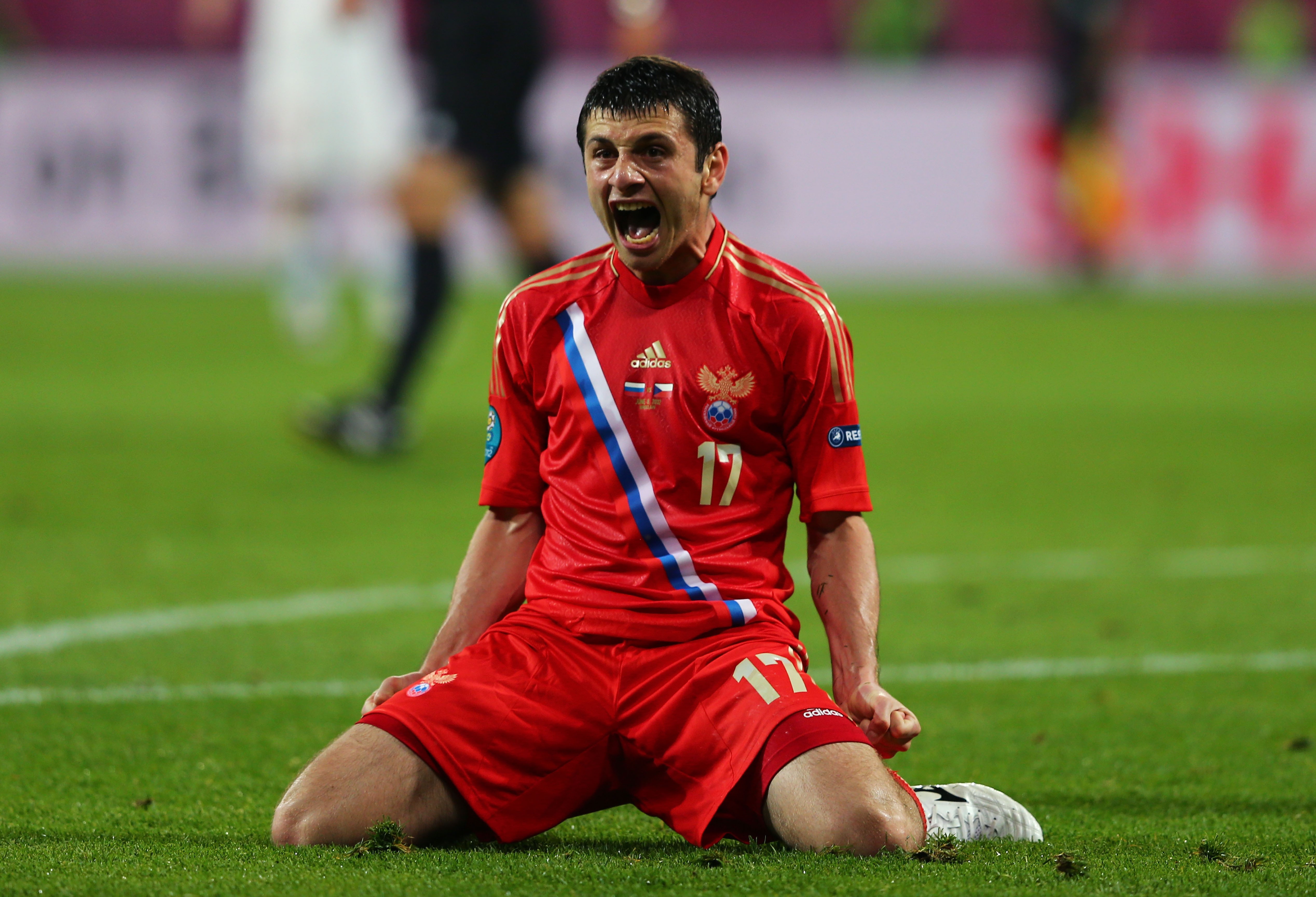 Football player in Russian uniform celebrating HD Wallpaper