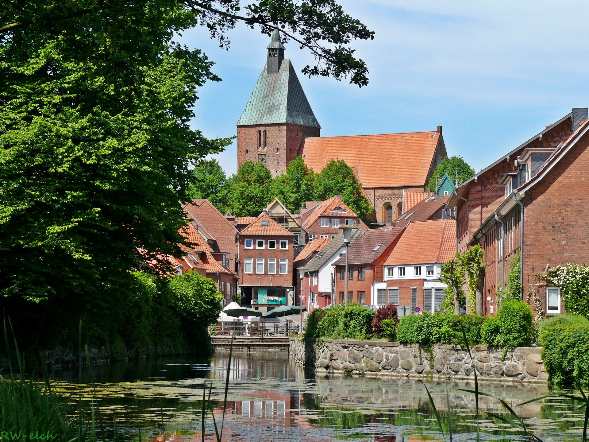 Town with canal and church in Germany HD Wallpaper