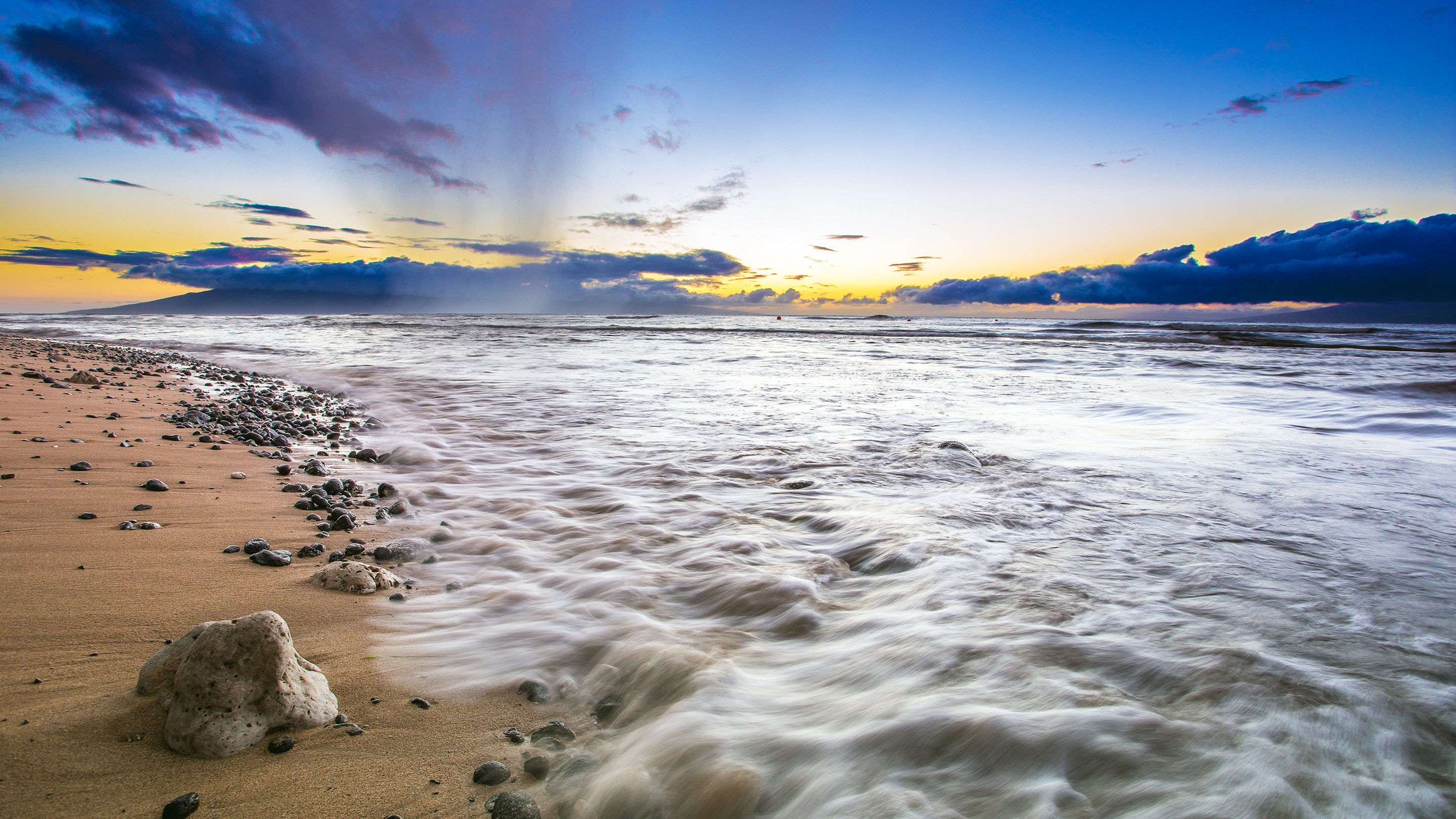 Ocean waves crashing on a rocky beach at sunset HD Wallpaper