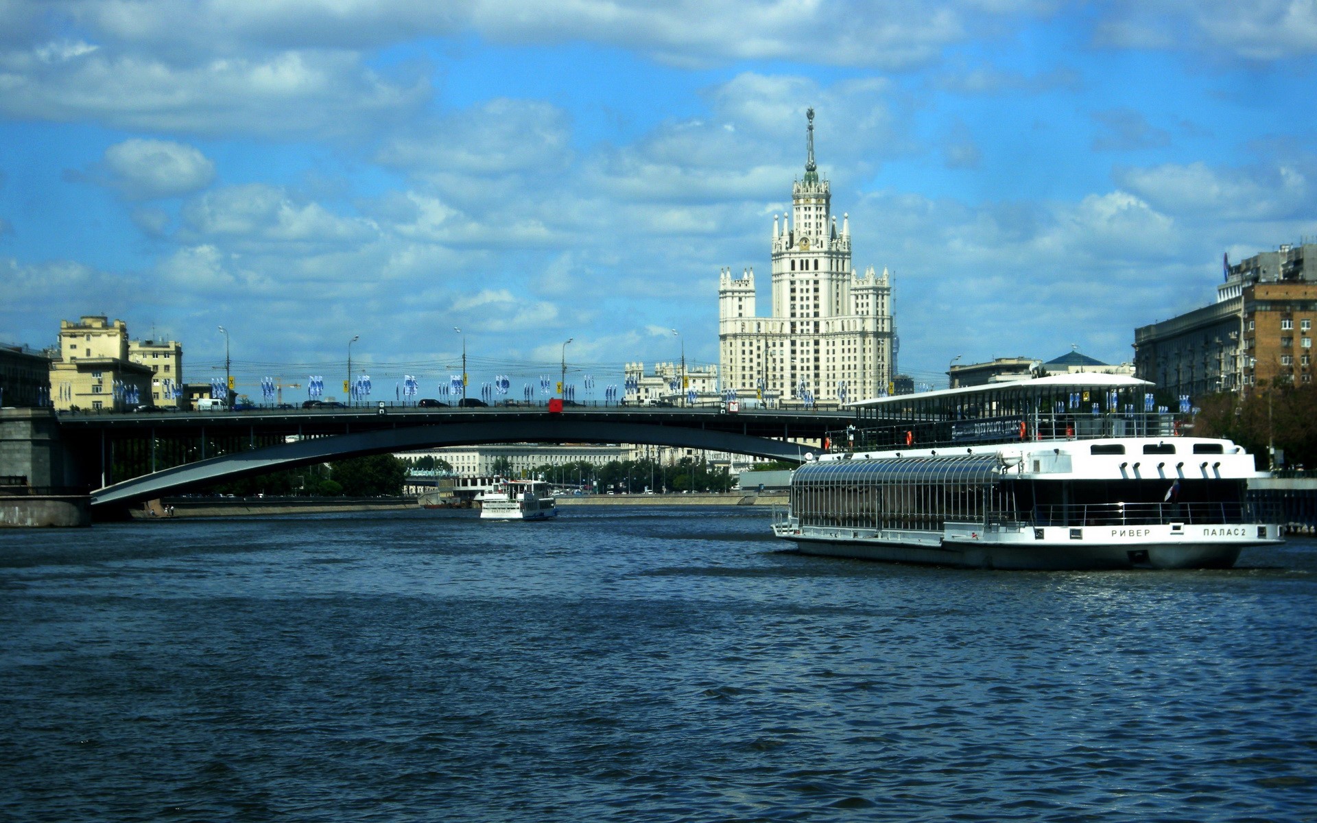 Stalinist skyscraper and river cruise ship in Moscow, Russia HD Wallpaper