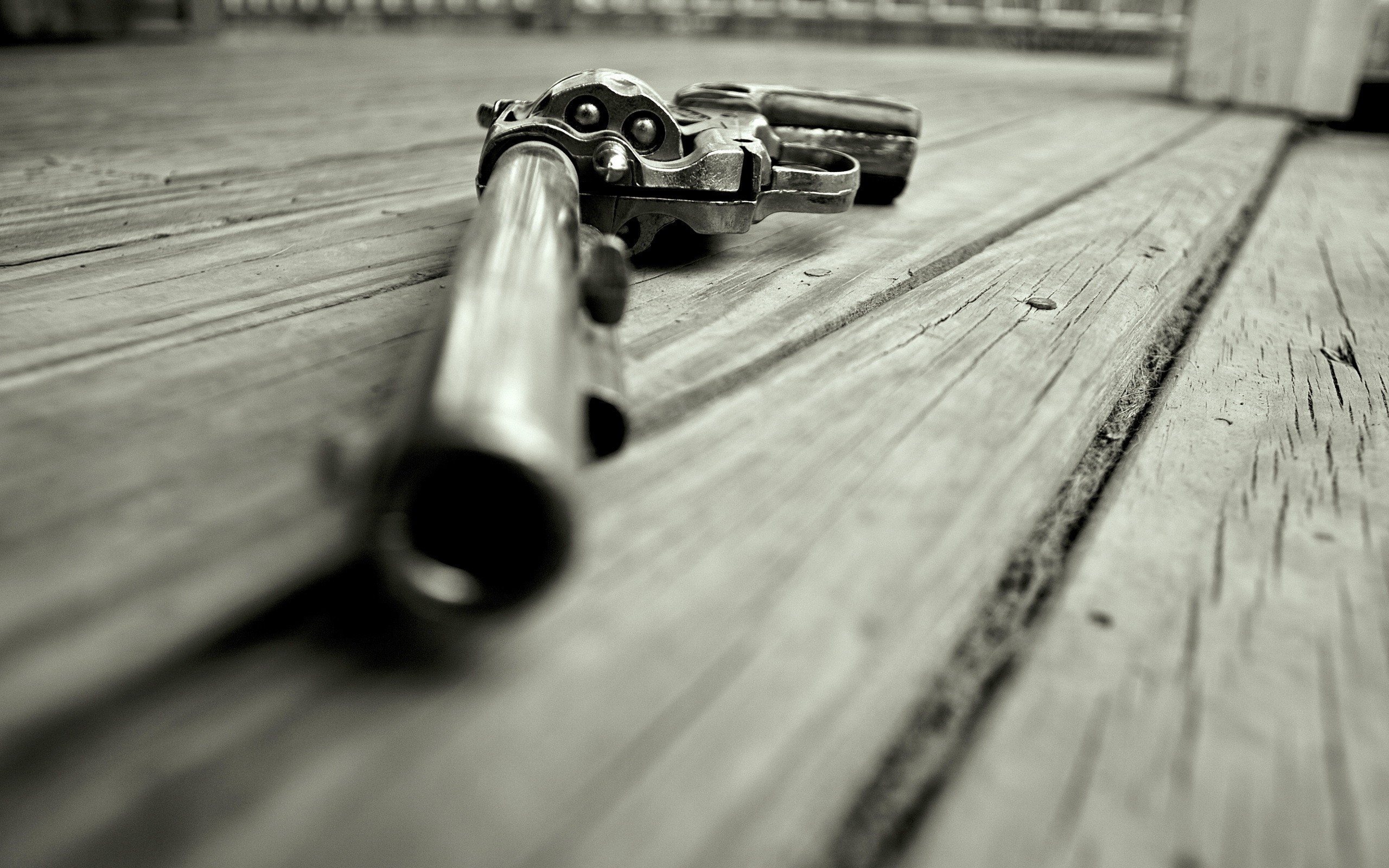Revolver pistol lying on wooden planks HD Wallpaper