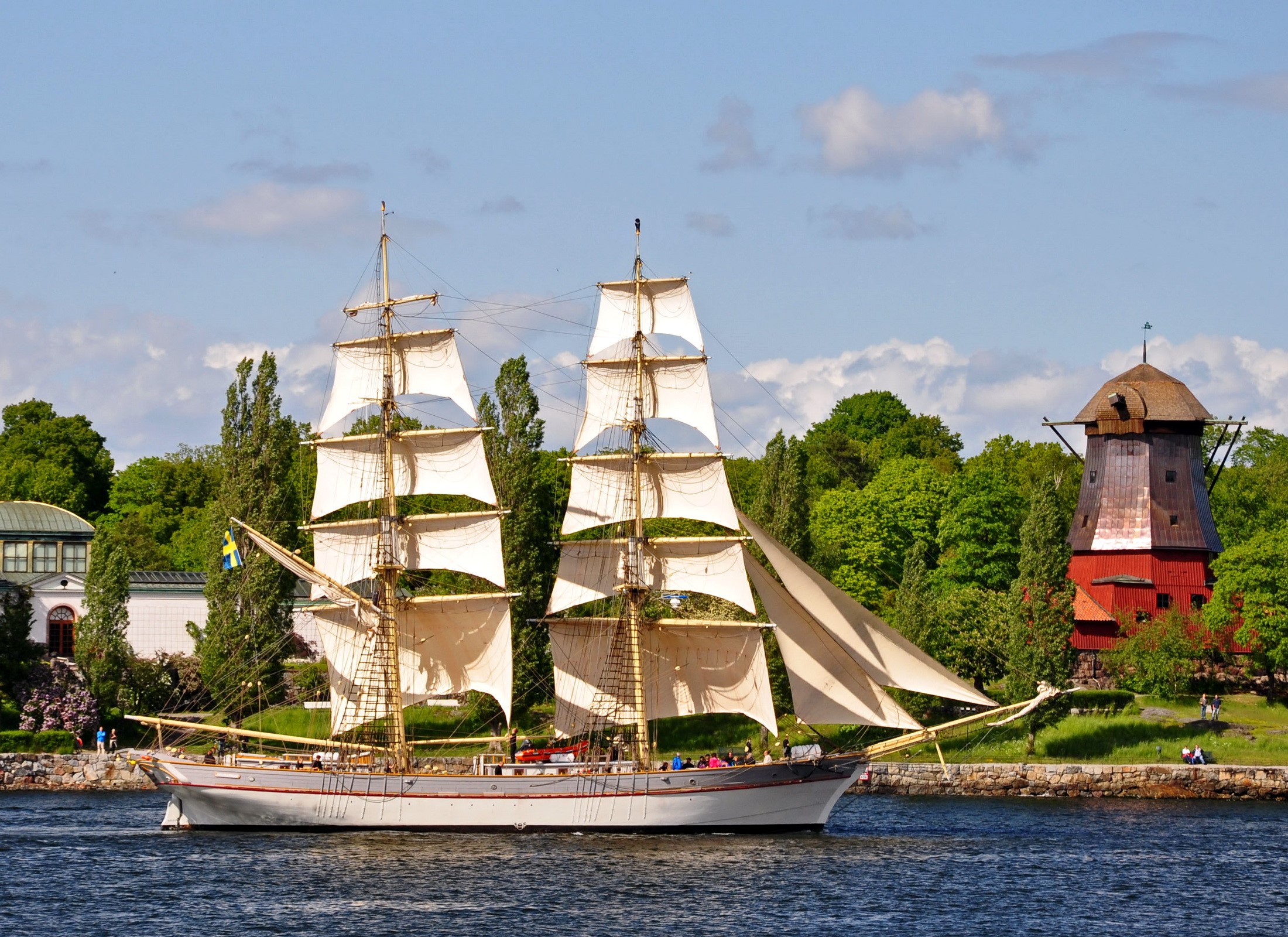 Tall Ship Sailing Past a Red Windmill HD Wallpaper