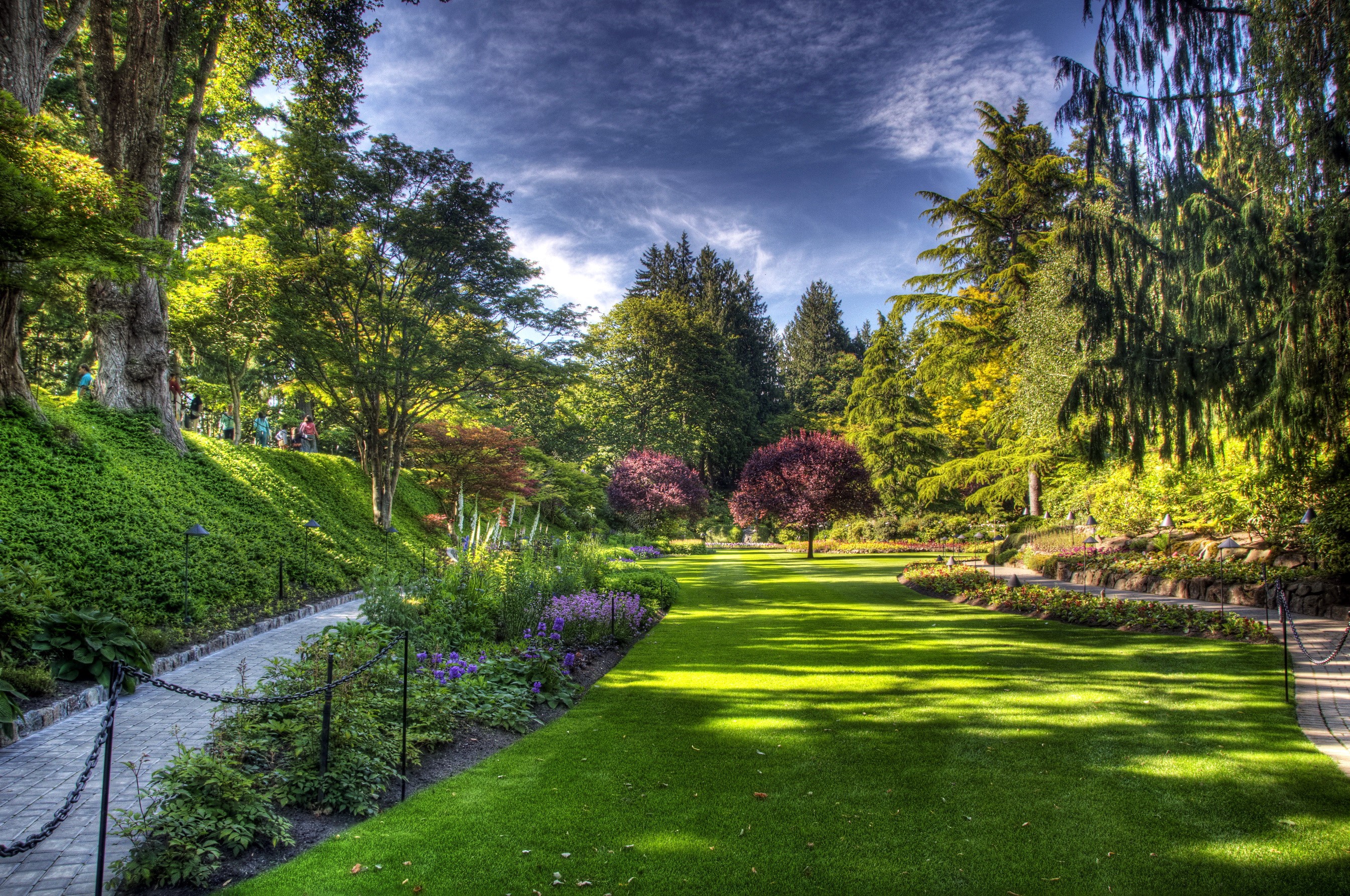 Beautiful Gardens with a Winding Path and Green Lawns HD Wallpaper