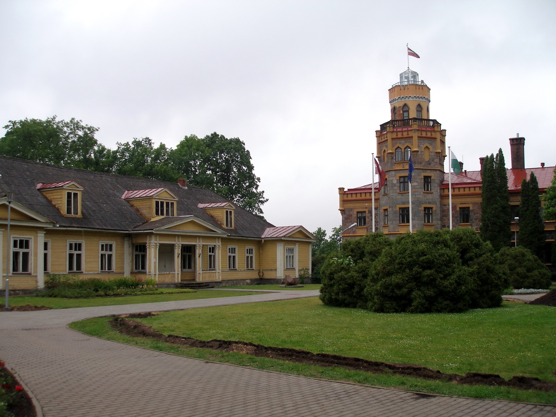 Yellow wooden house and stone tower building HD Wallpaper