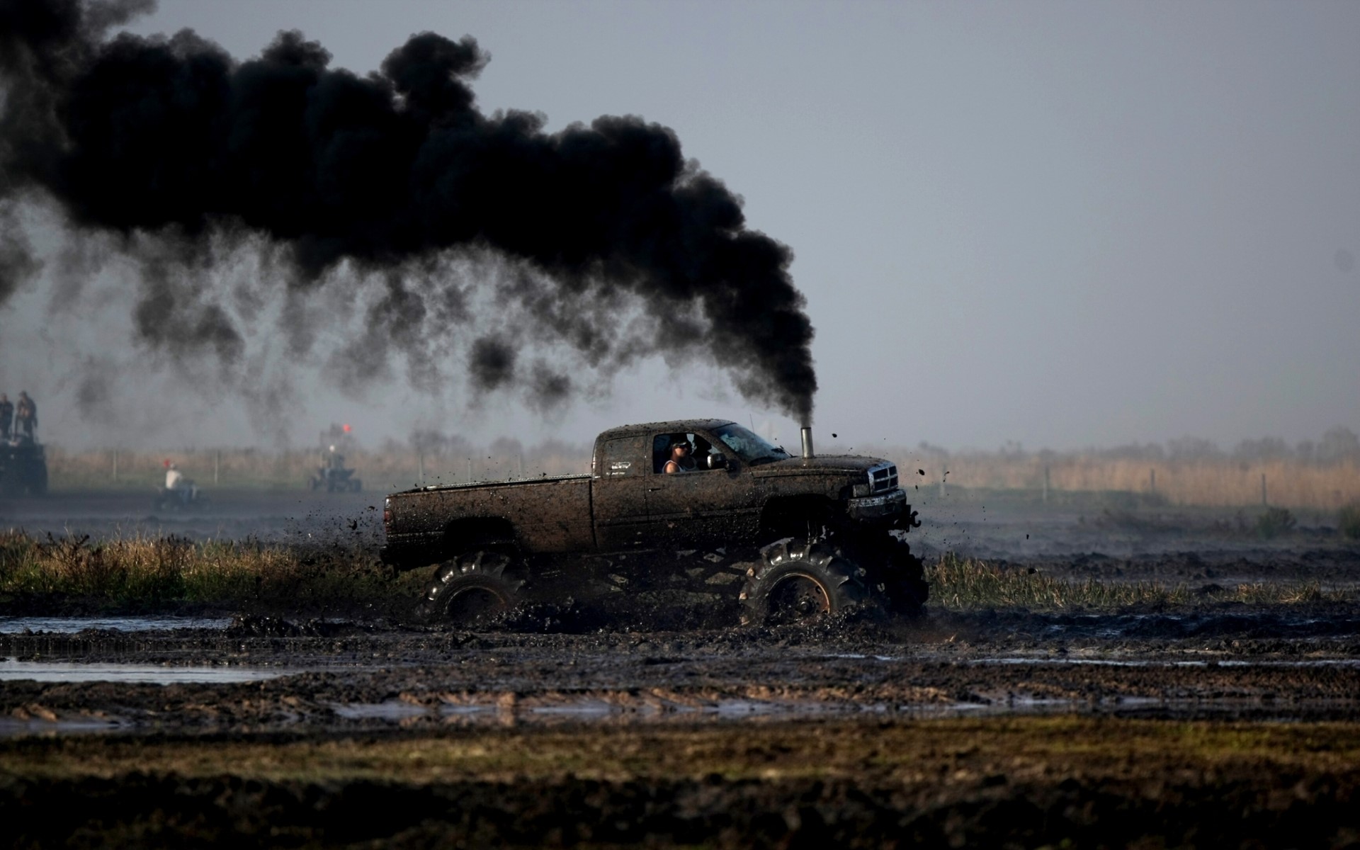 Dodge Ram truck emitting black smoke in mud HD Wallpaper