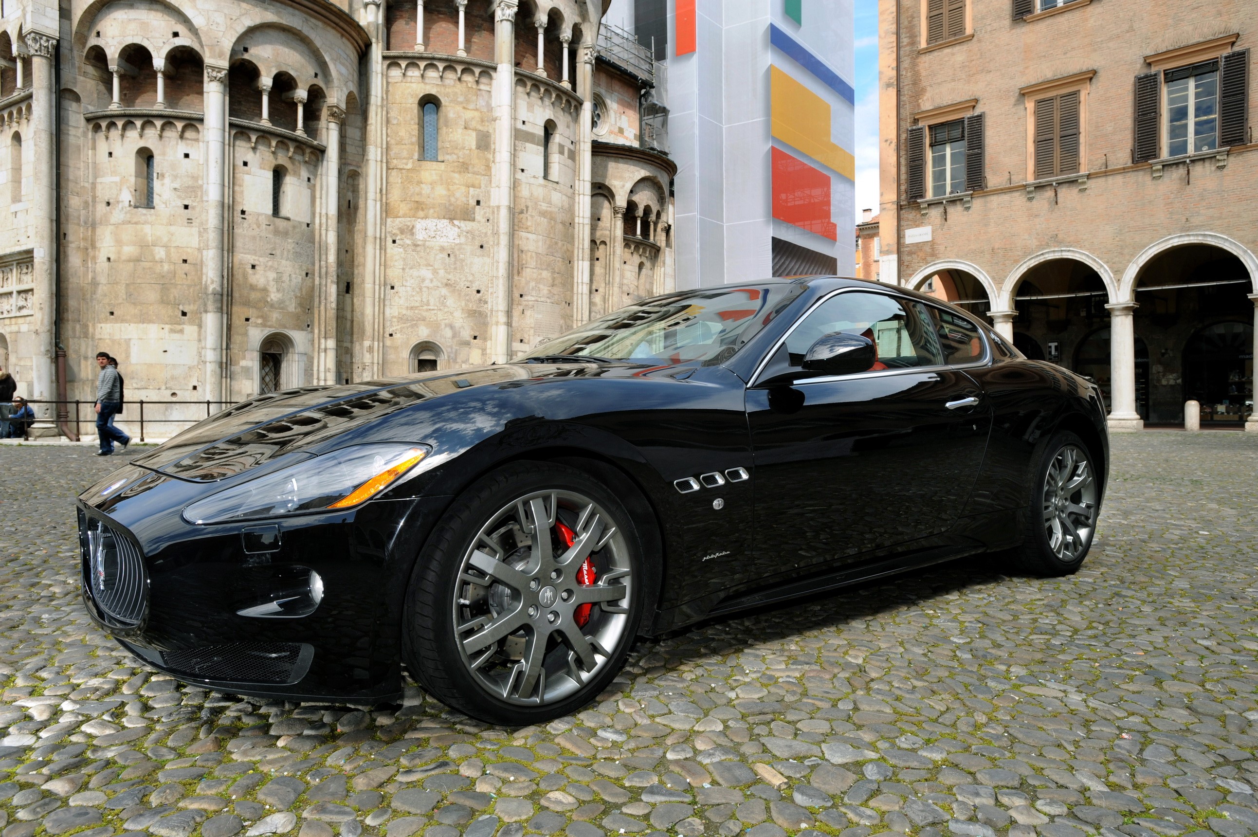 Black Maserati GranTurismo S parked on cobblestone street HD Wallpaper