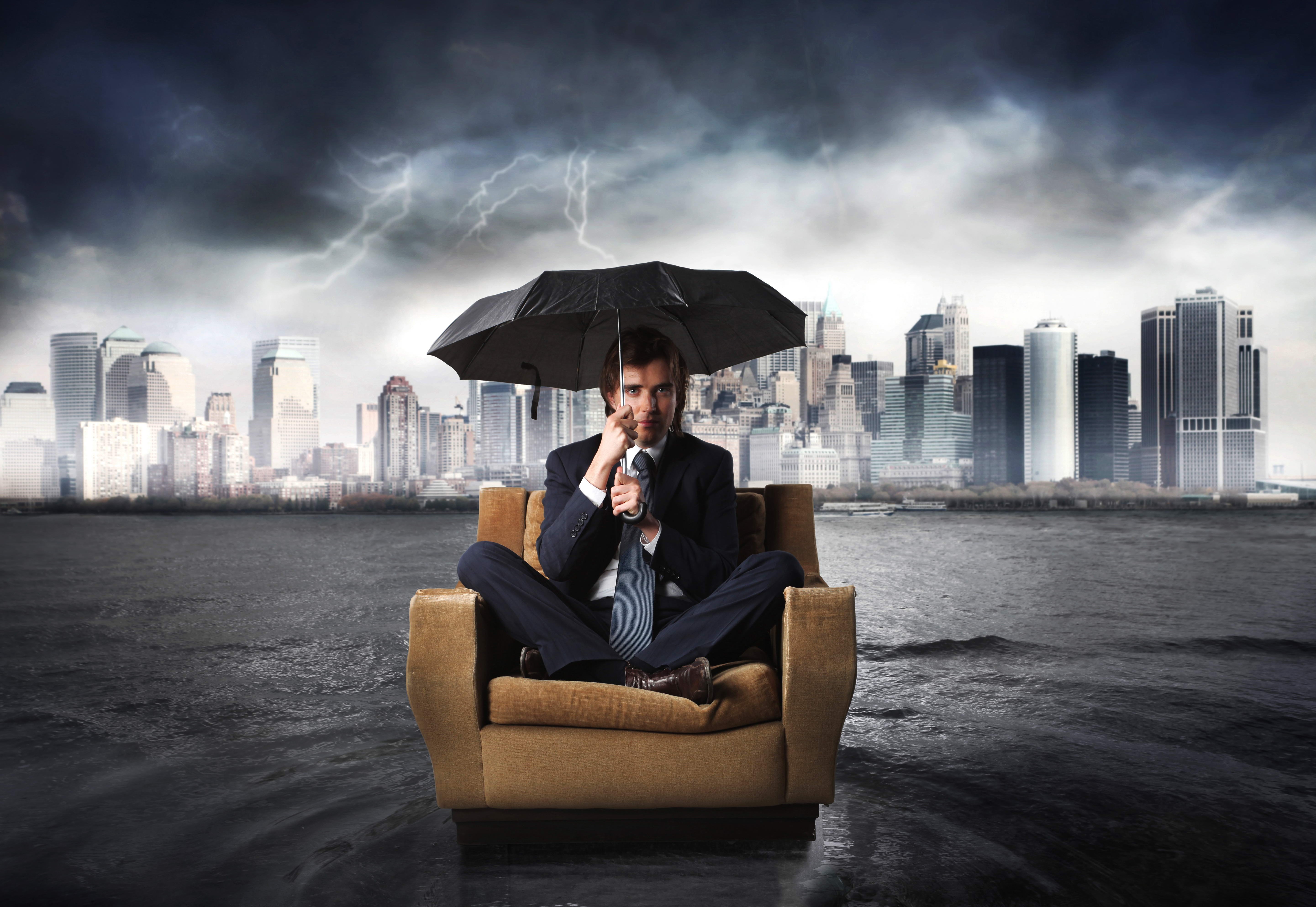 Man in Suit with Umbrella in Flooded City HD Wallpaper