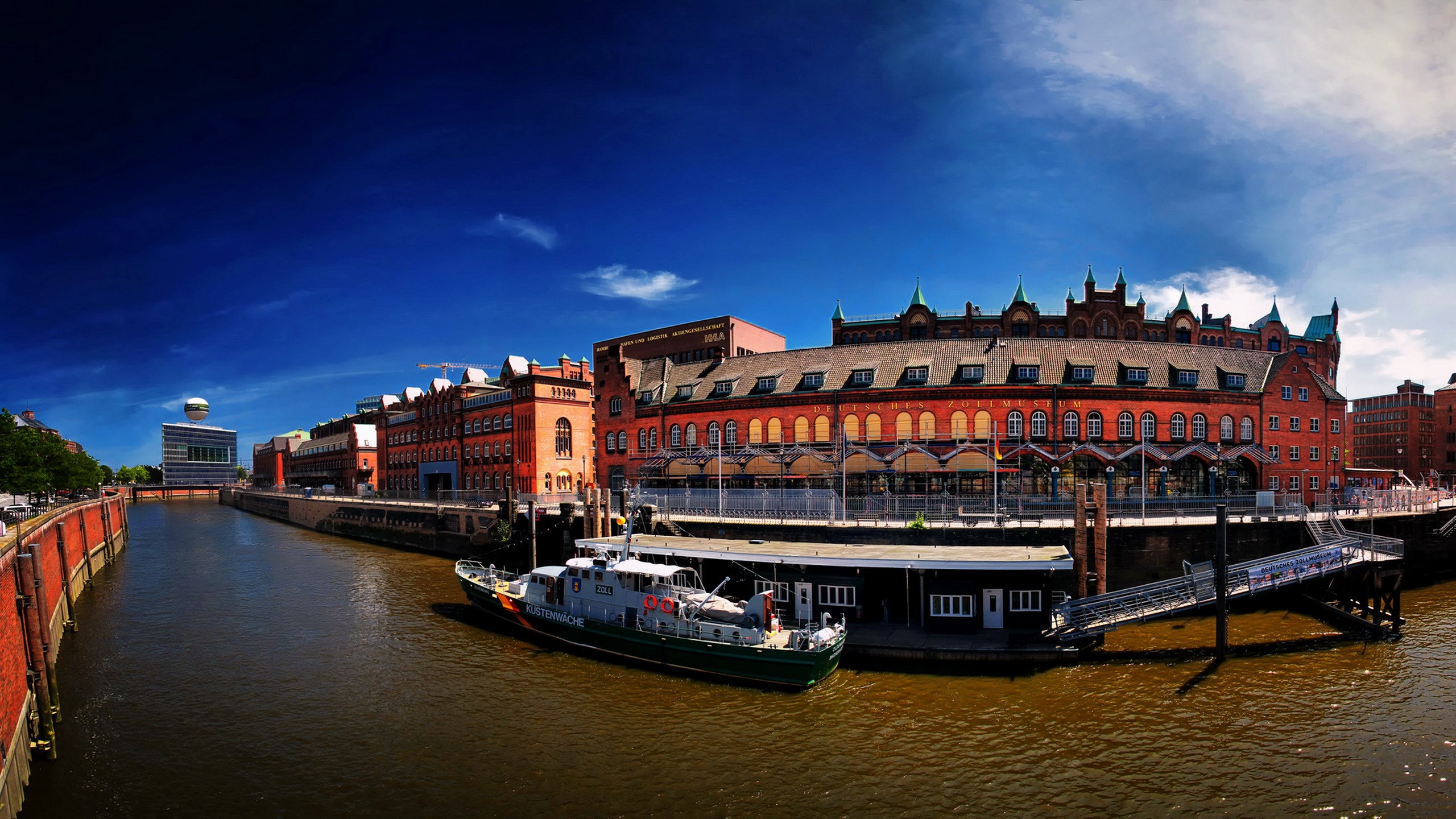 Hamburg Speicherstadt with a boat on the canal HD Wallpaper