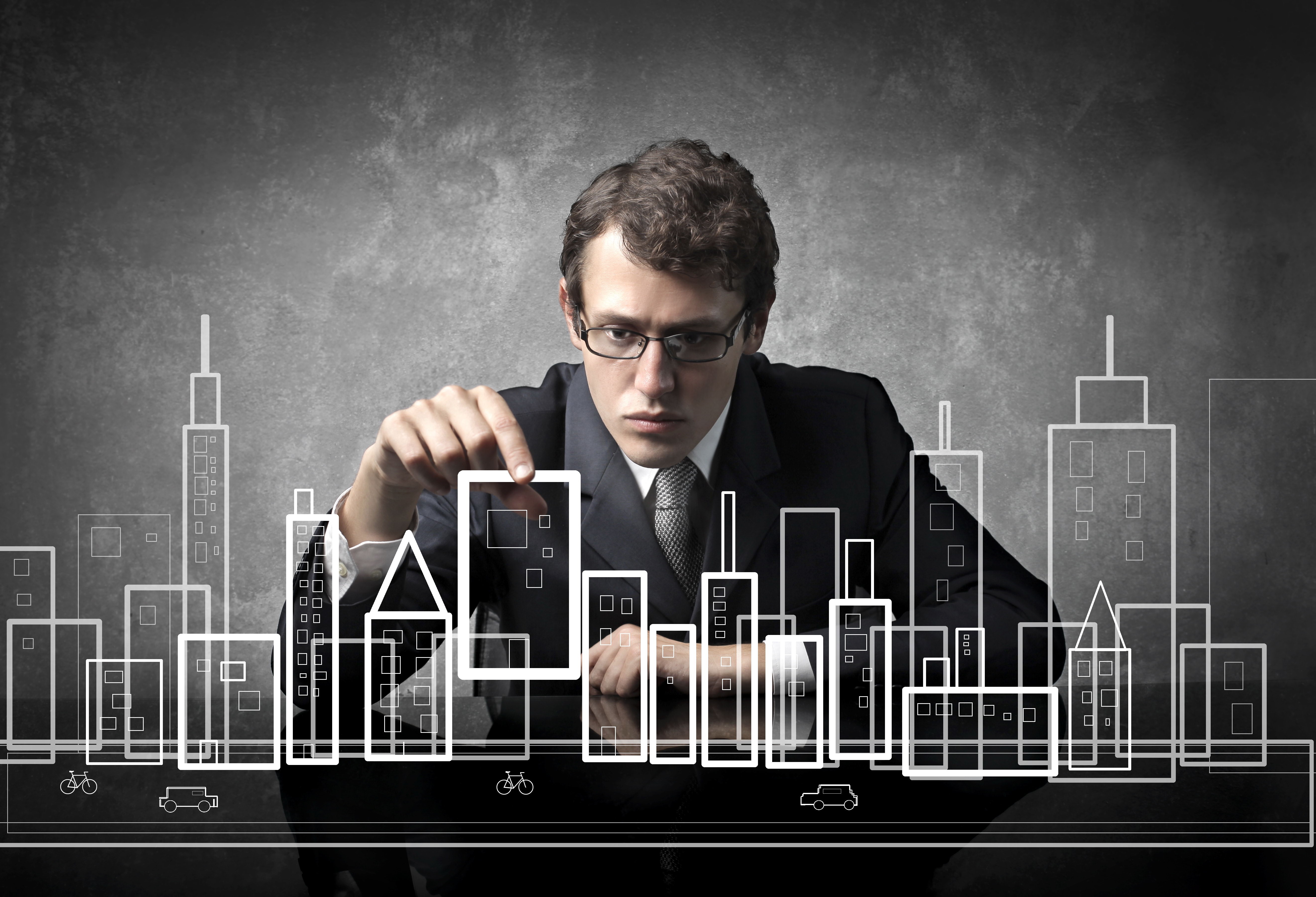 Man designing a city model HD Wallpaper