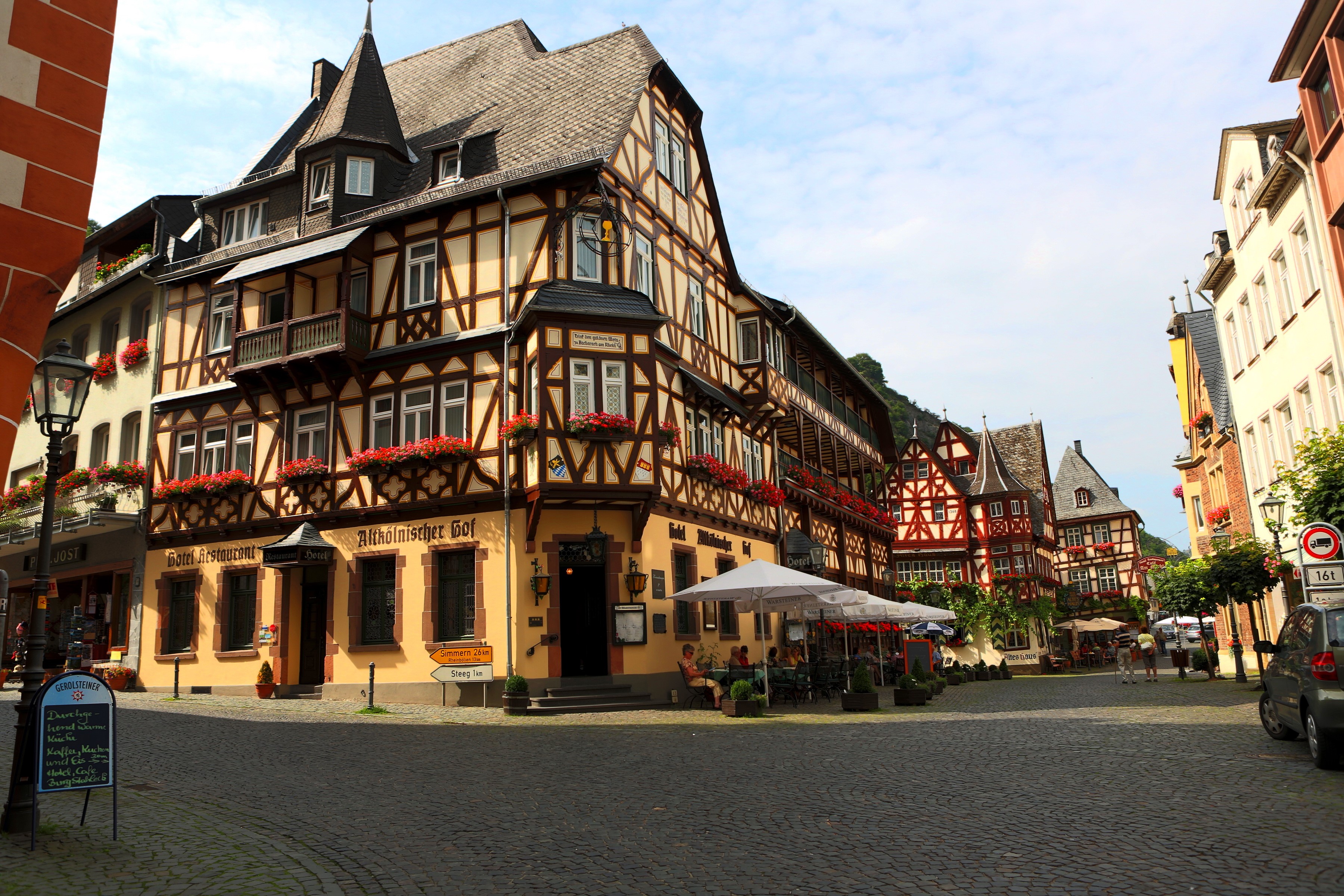 Half-timbered buildings in a German town square HD Wallpaper