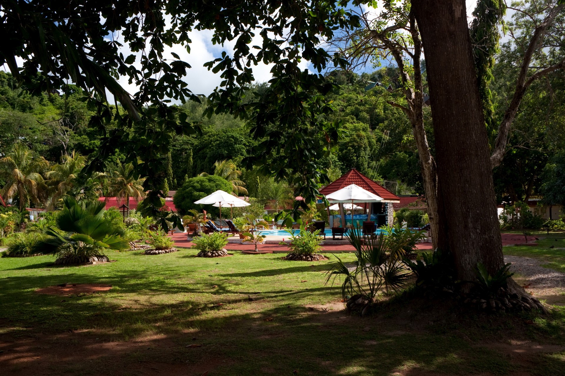 Resort in Praslin, Seychelles with pool and tropical garden HD Wallpaper