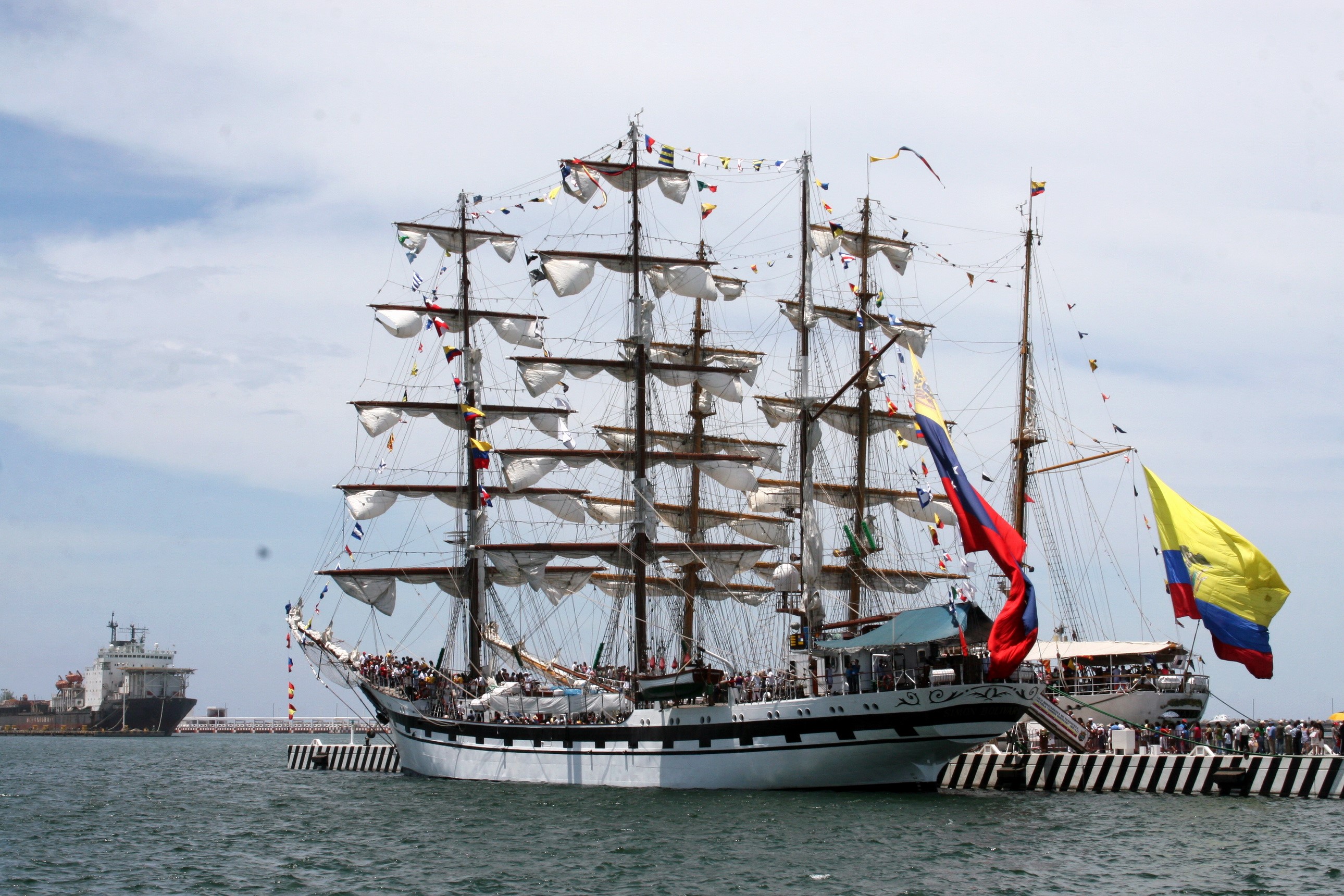 Tall Ship with Flags Docked at Port HD Wallpaper