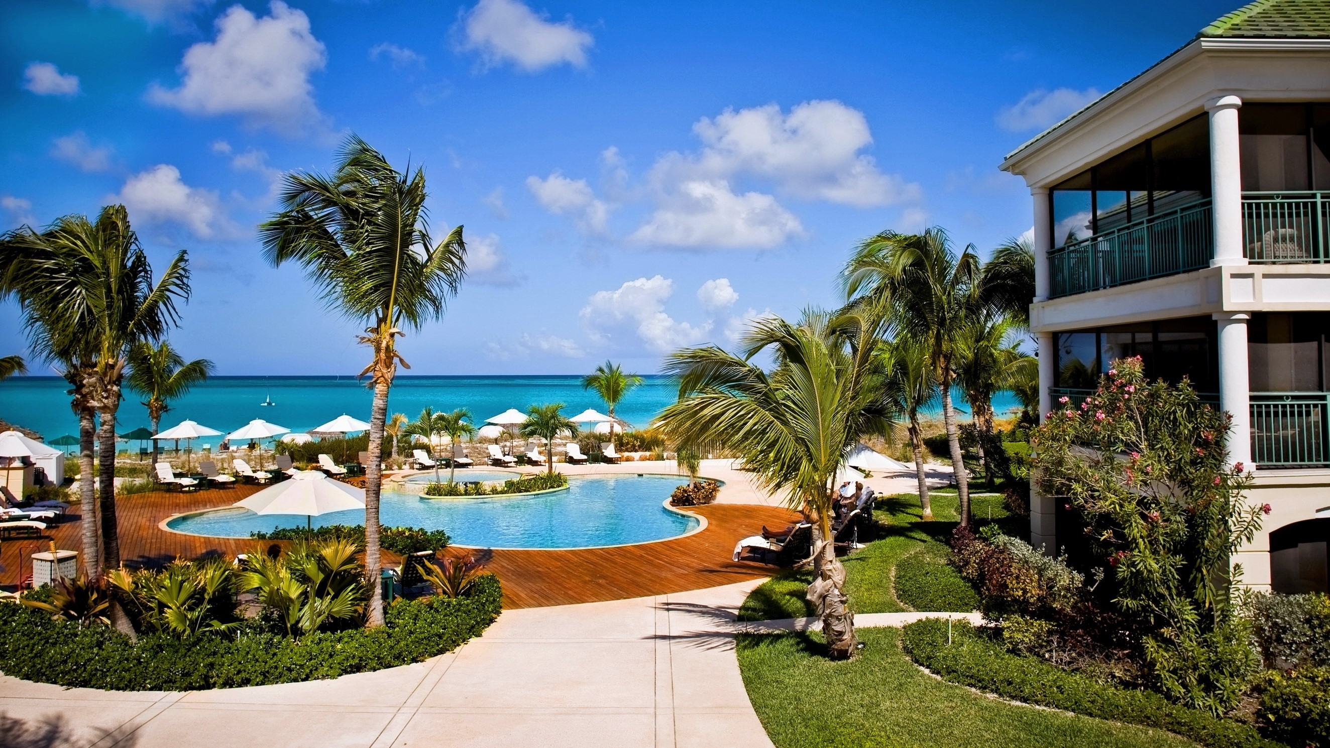 Caribbean resort with pool and beach HD Wallpaper