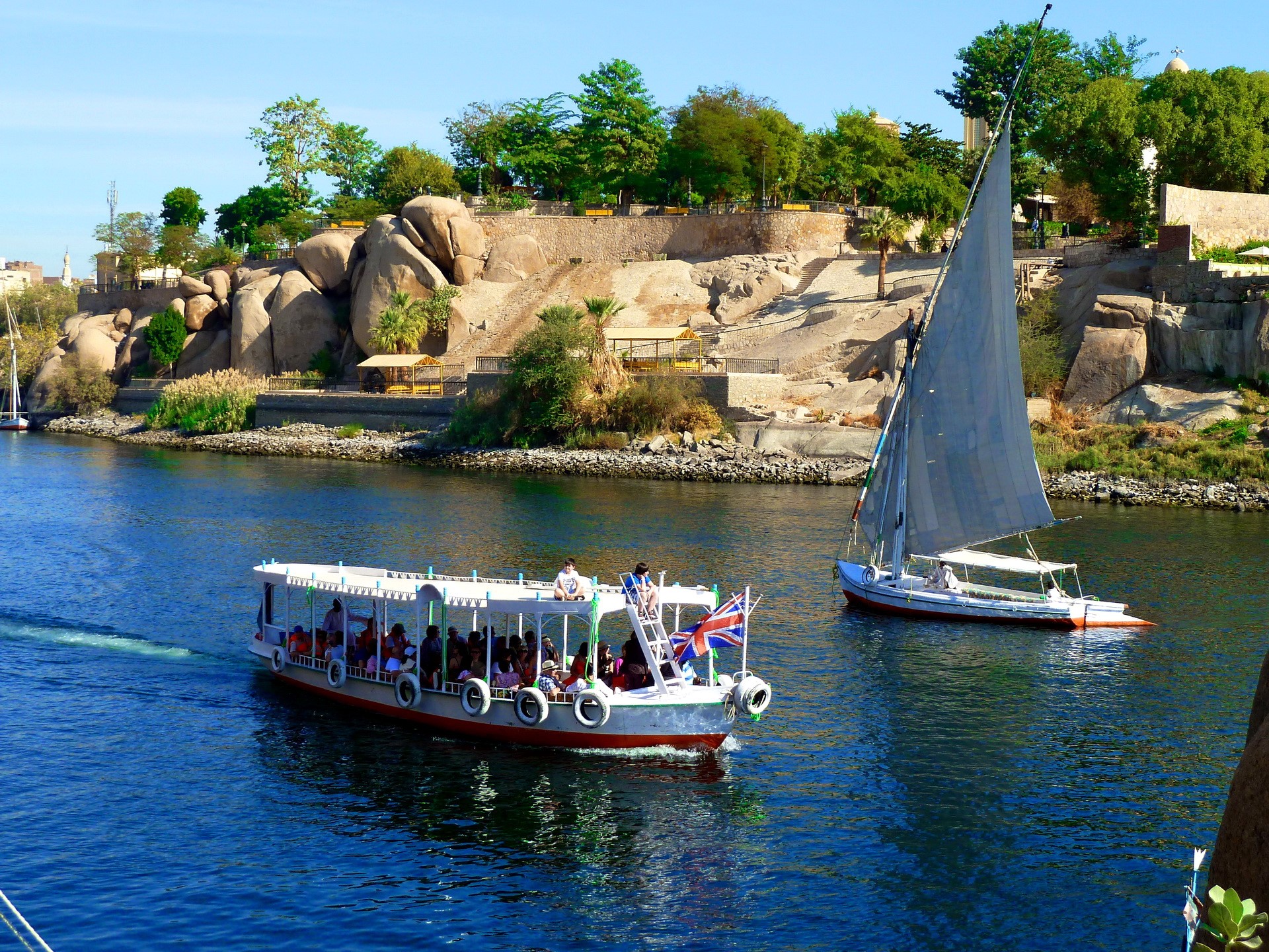 Tour boat and sailboat on the Nile River HD Wallpaper