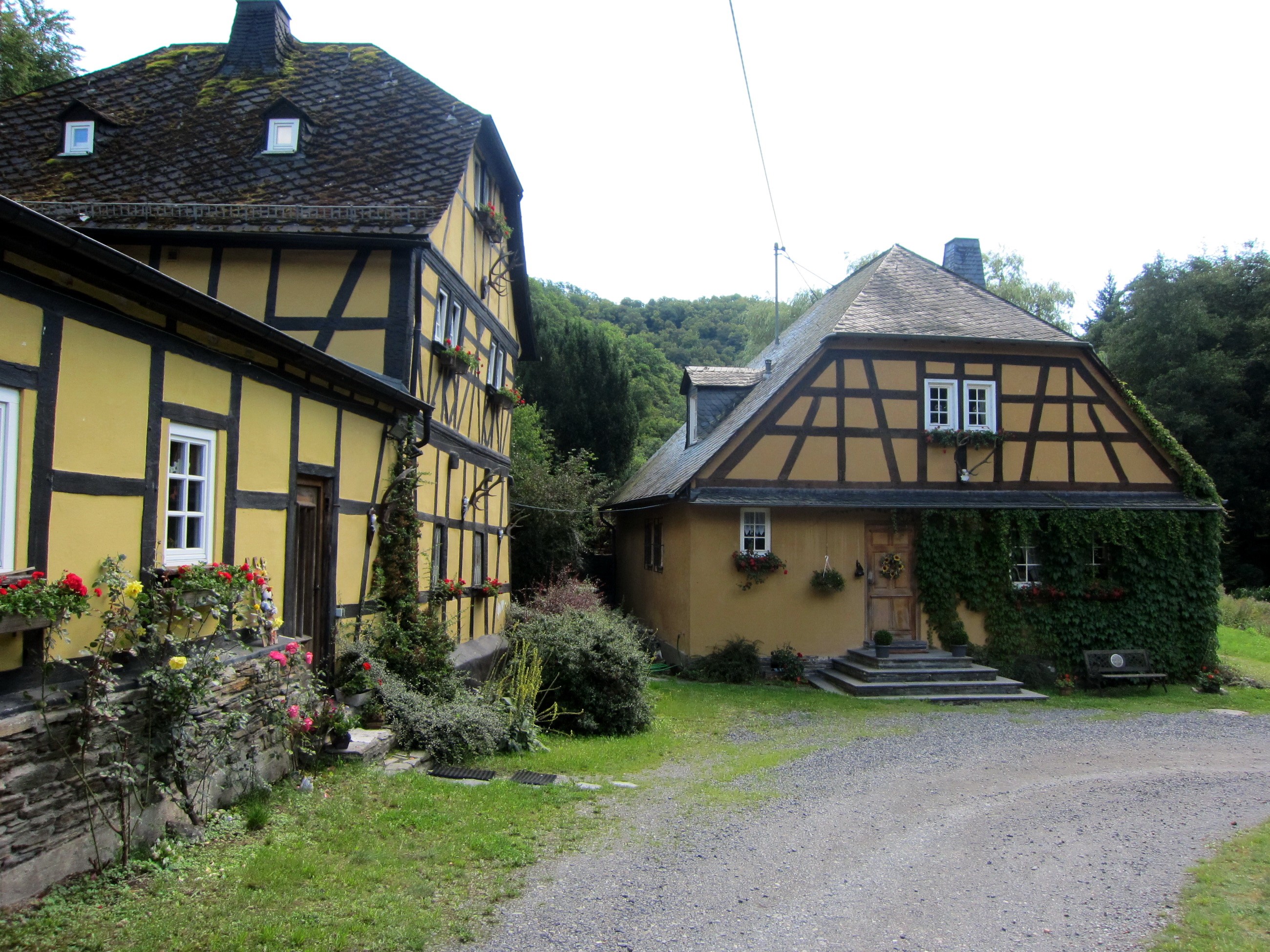 Half-timbered houses in a rural setting HD Wallpaper