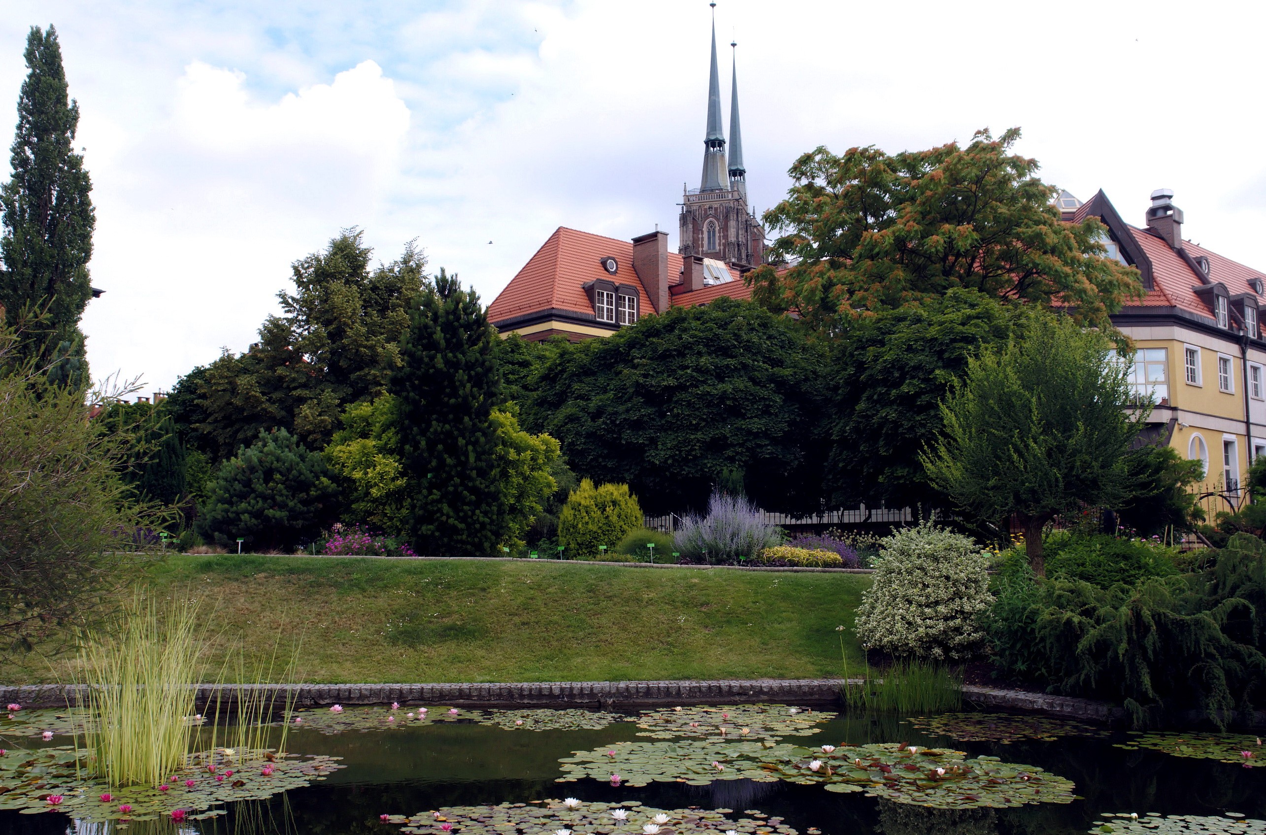 Botanical Garden Pond with Church Spires in Wroclaw, Poland HD Wallpaper