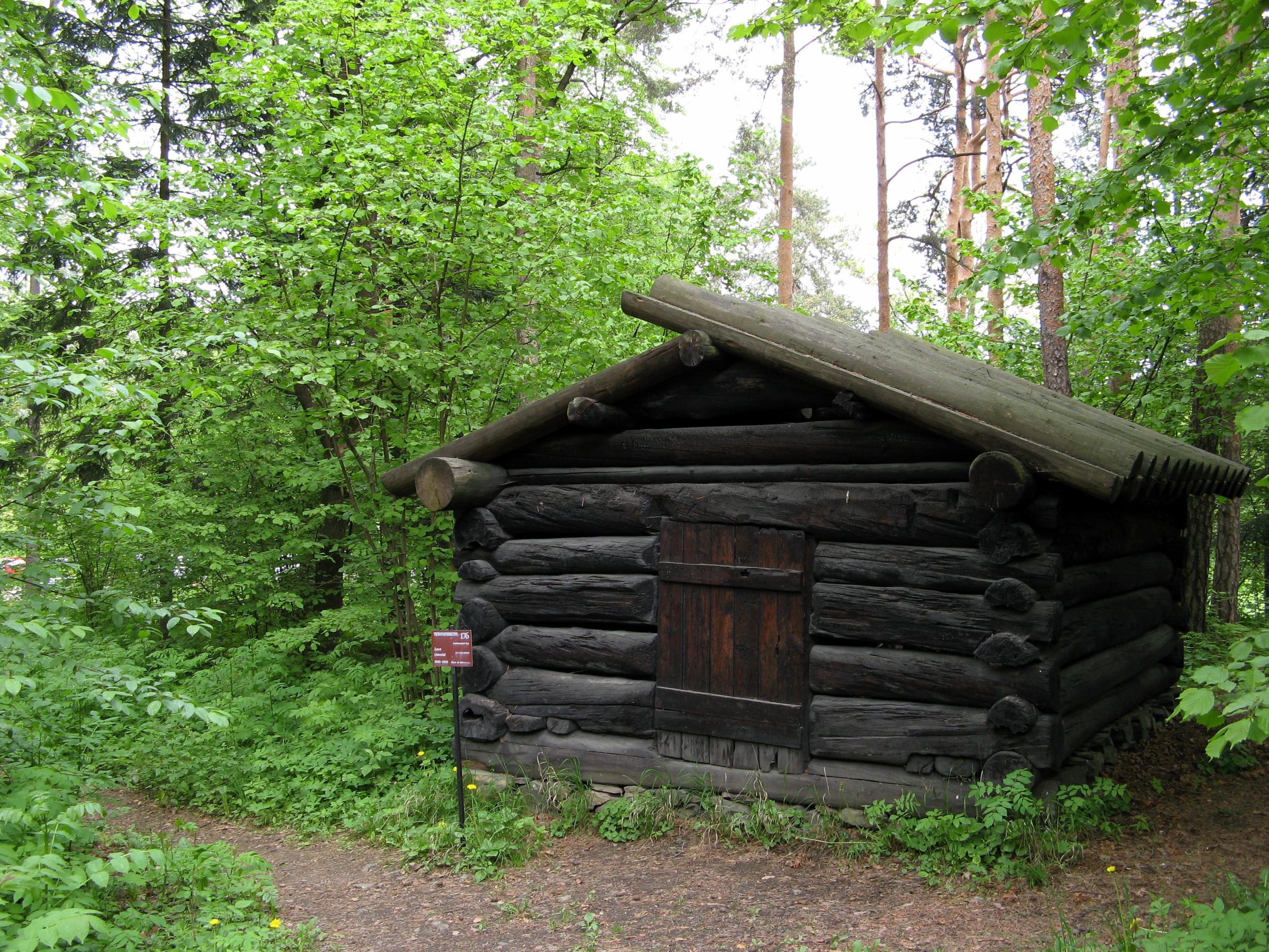 Log cabin in a forest at Norwegian Folk Museum HD Wallpaper