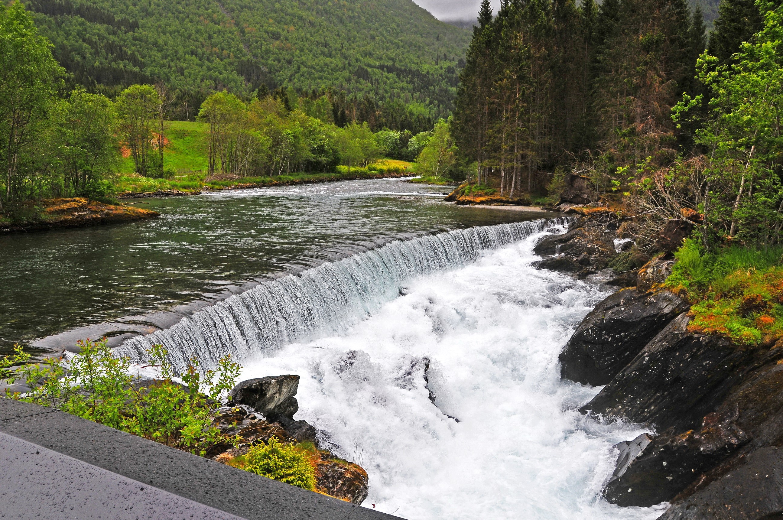 Waterfall in a Forested Mountain Landscape HD Wallpaper