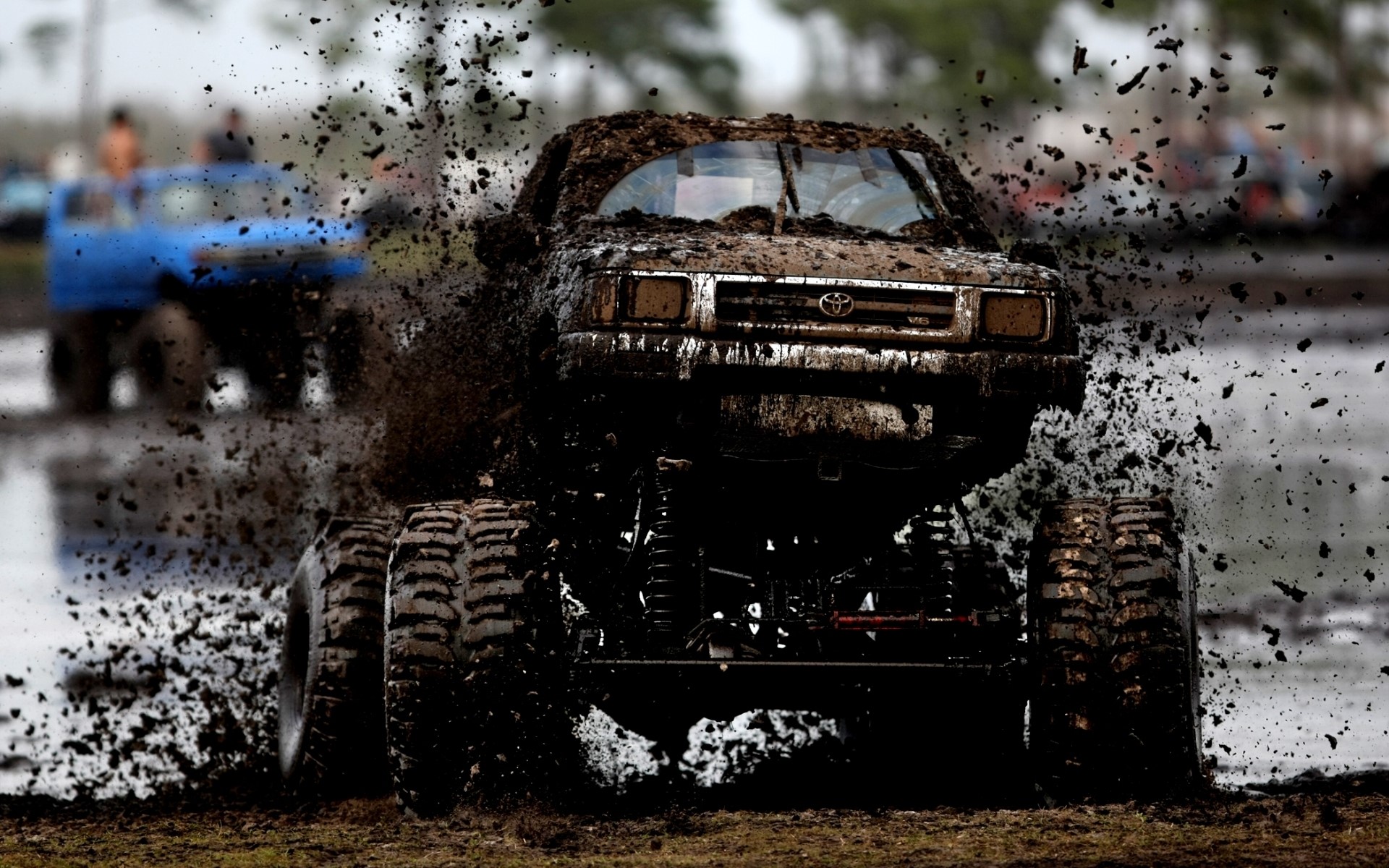 Muddy Toyota Hilux truck in a mud bog HD Wallpaper