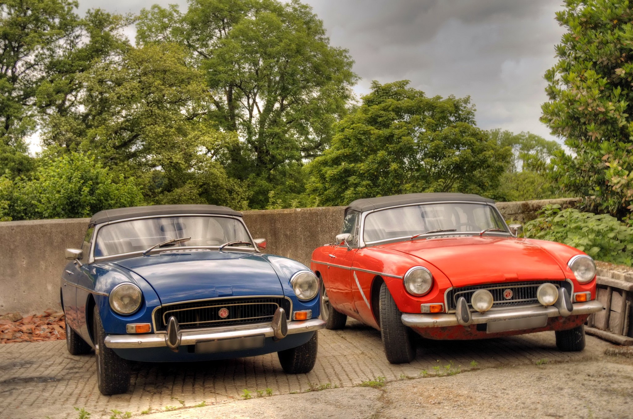 Two classic MG convertible cars parked outdoors HD Wallpaper