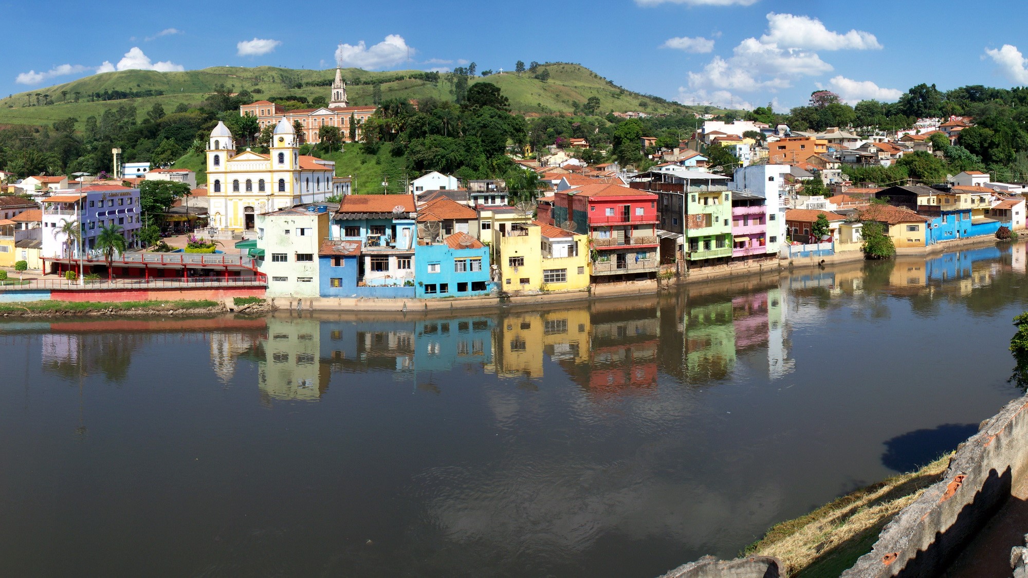 Colorful buildings along a river in Brazil HD Wallpaper