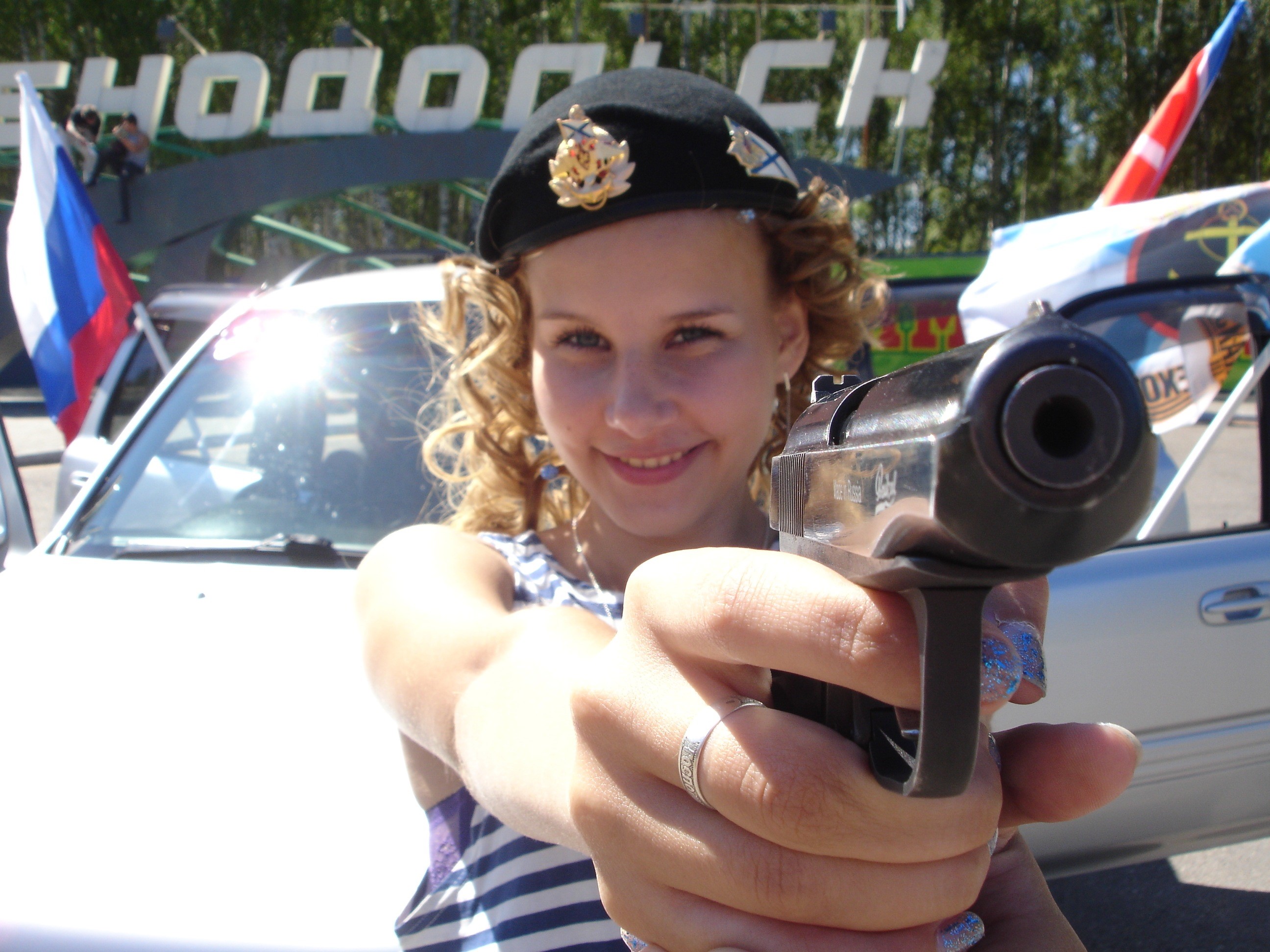 Girl in Beret Holding a Pistol HD Wallpaper