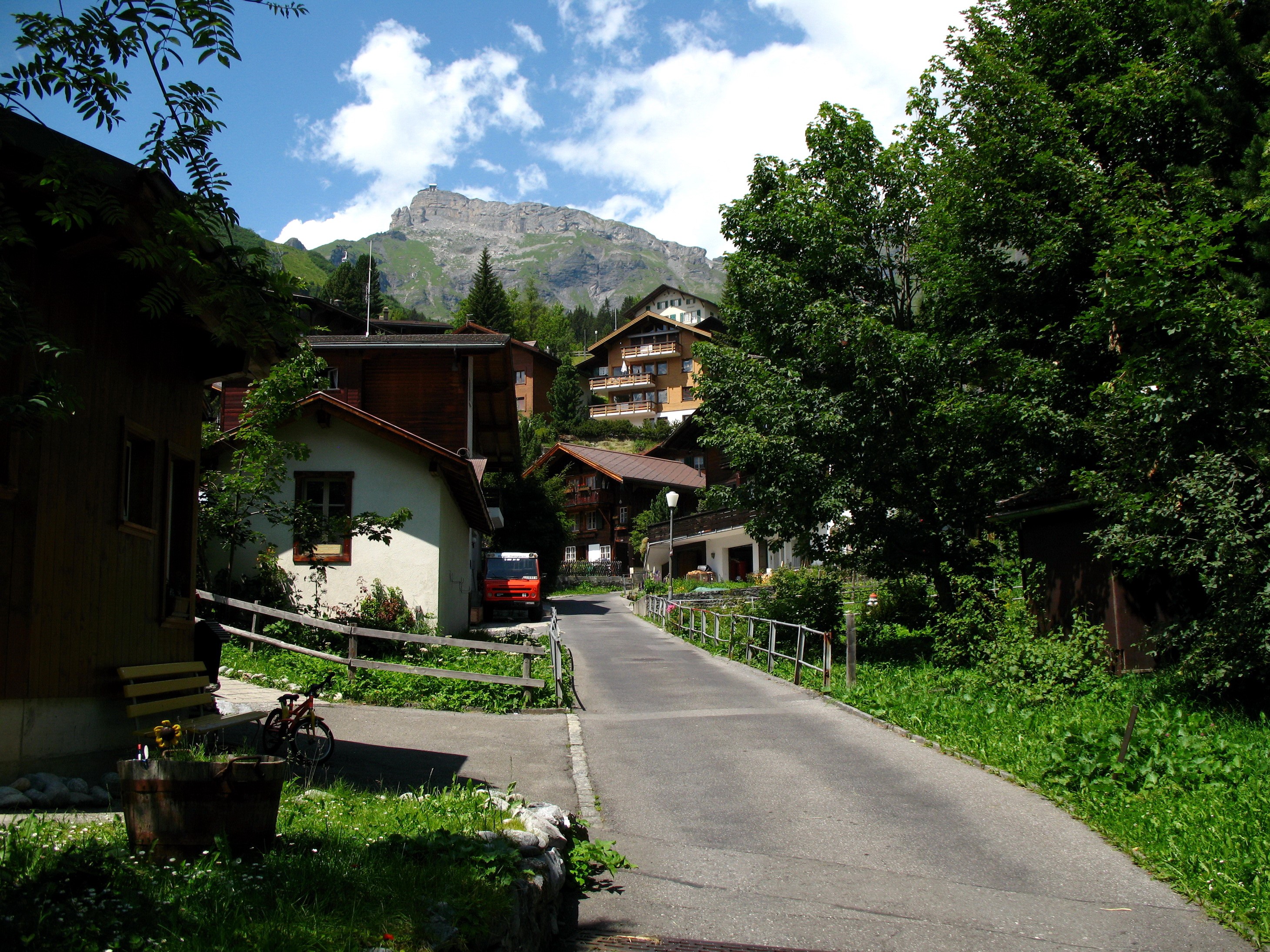 Street in Niedenmatten, Switzerland with Mountain View HD Wallpaper