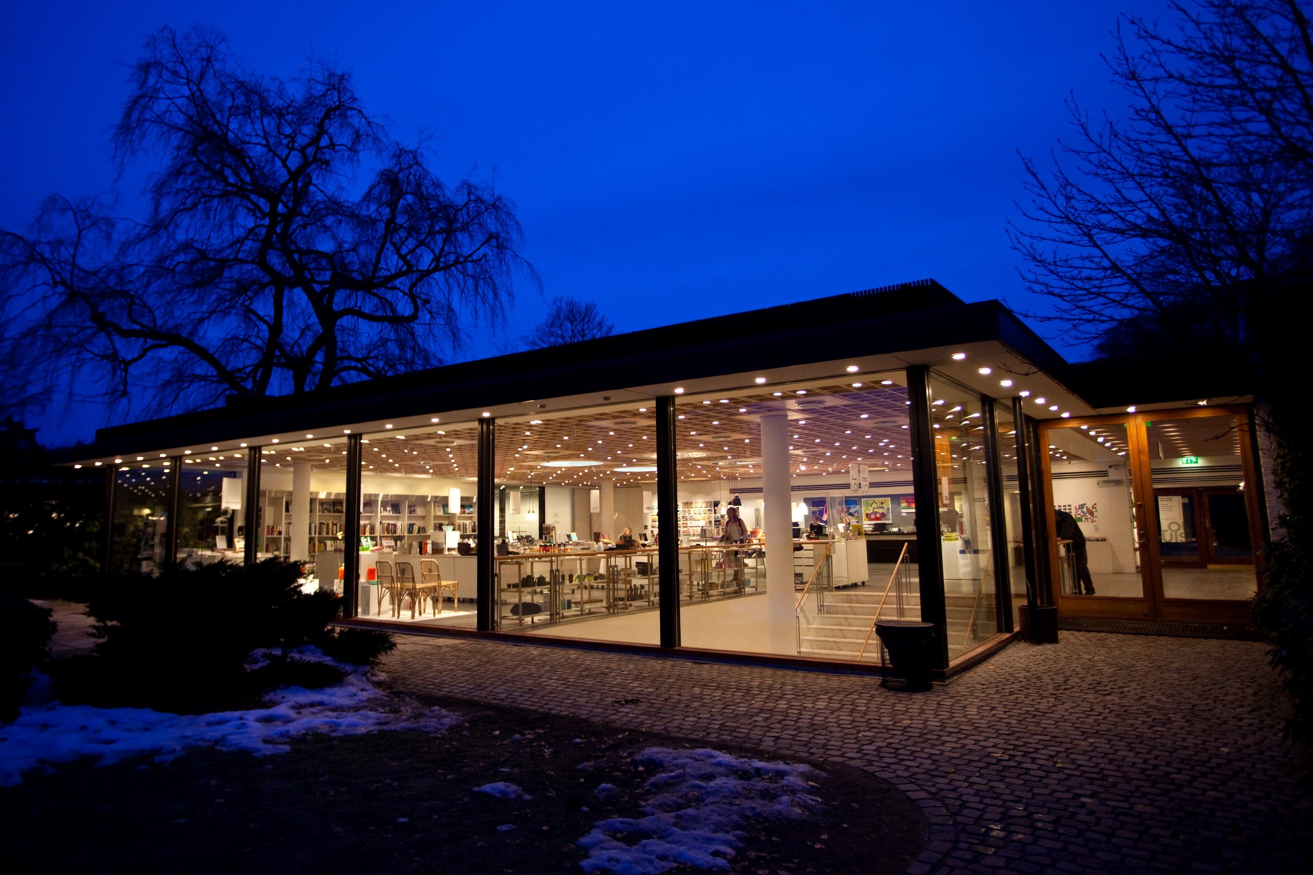 Modern glass building at night in Denmark HD Wallpaper