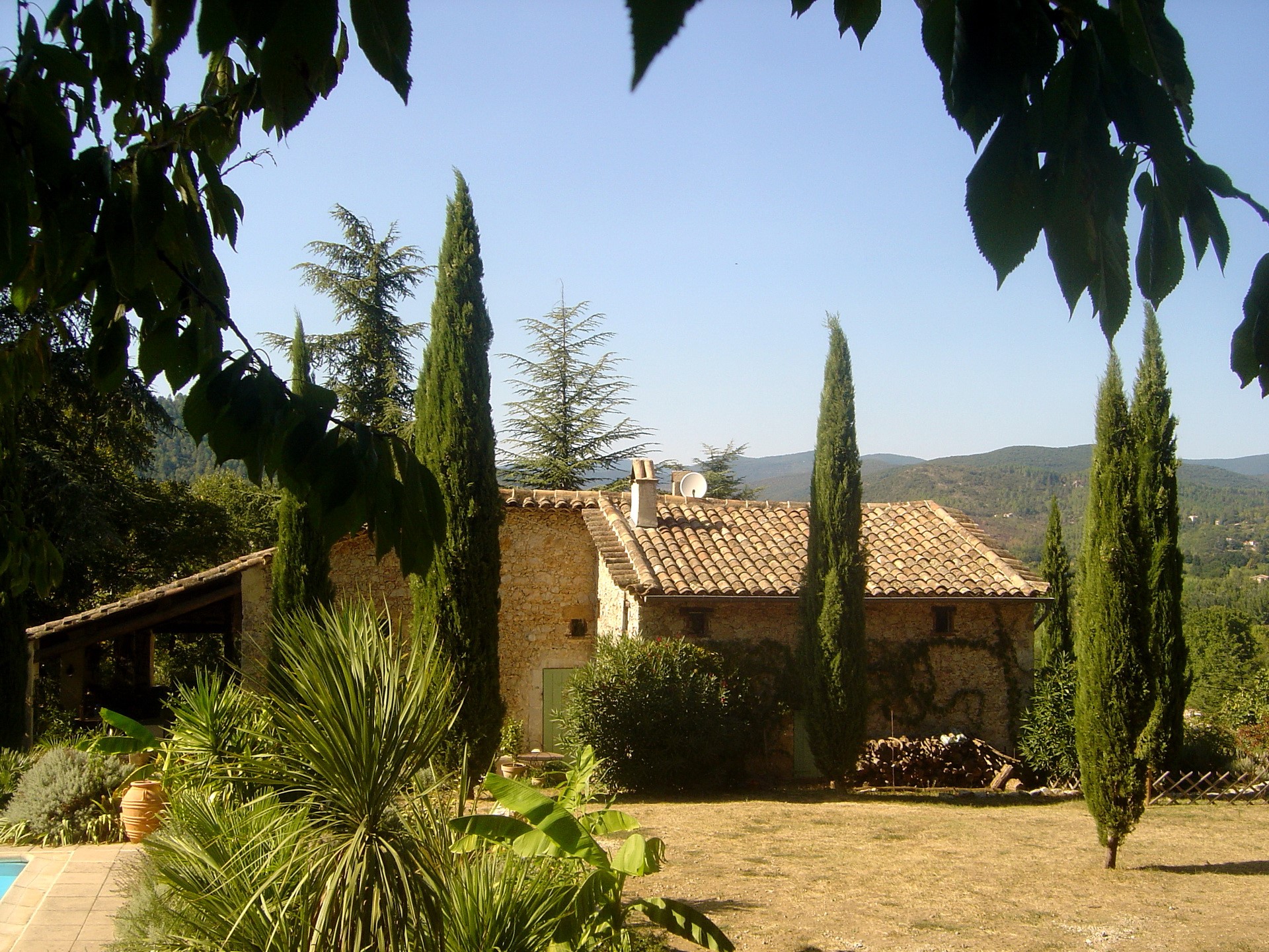 Stone house with cypress trees in France HD Wallpaper