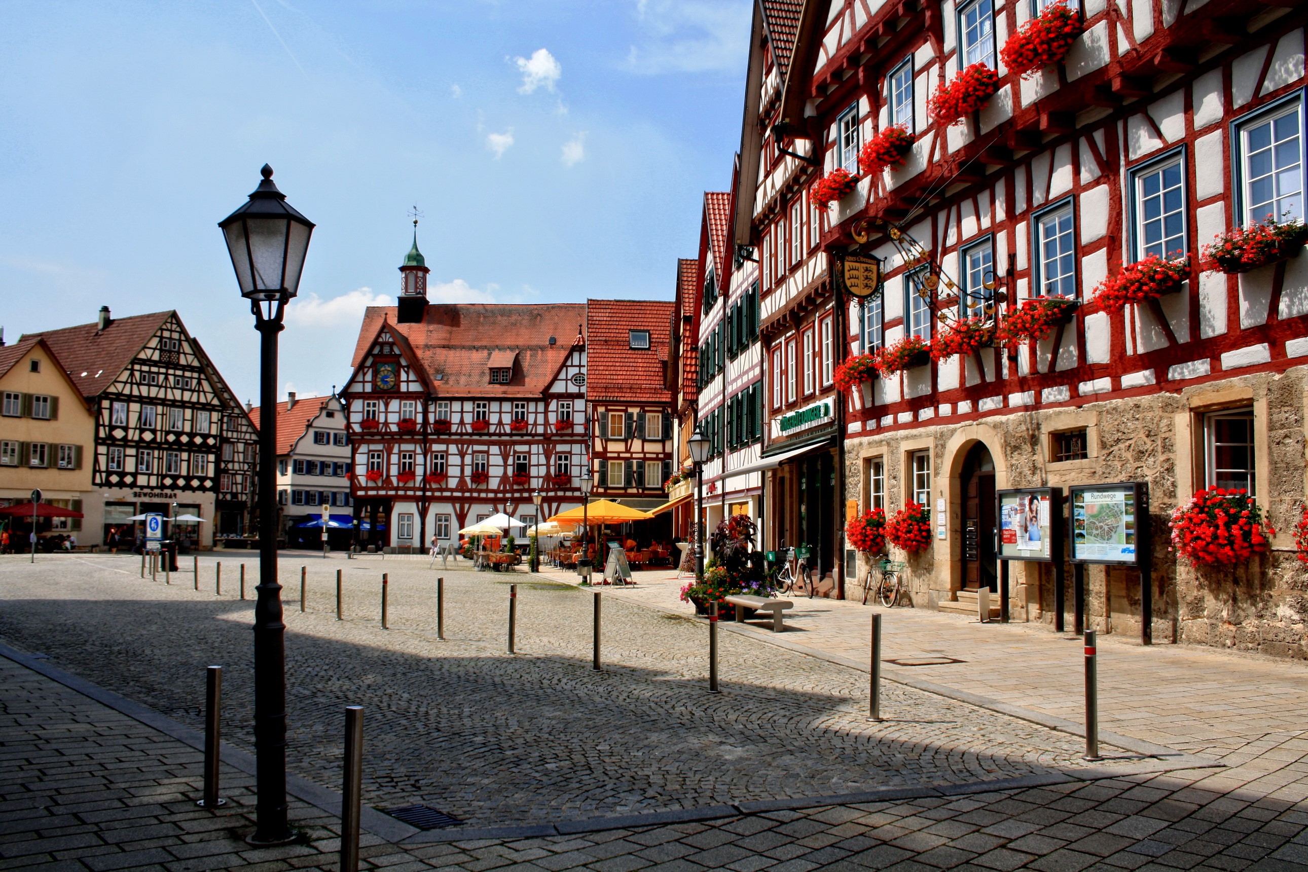 Half-timbered buildings in a German town square HD Wallpaper
