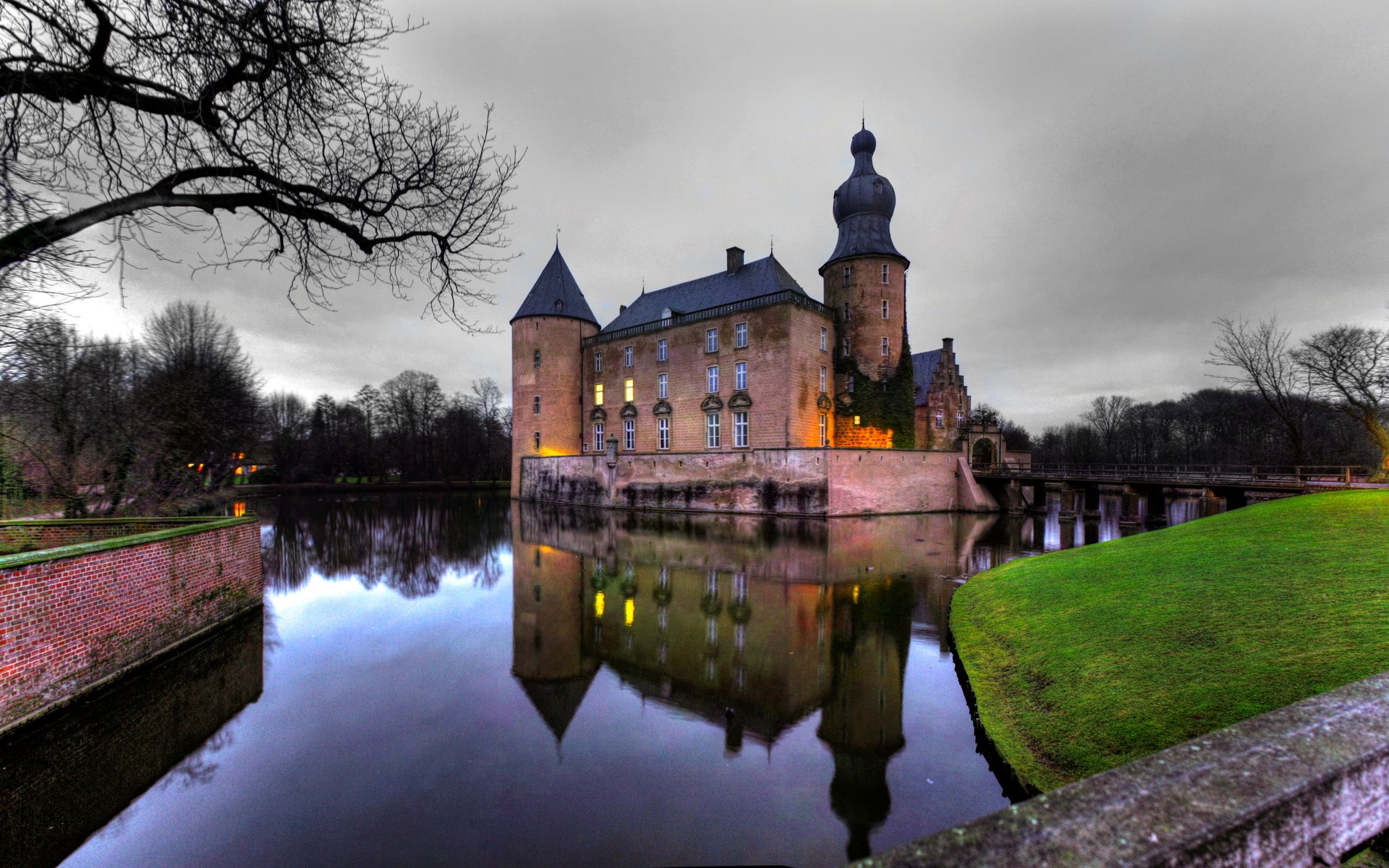 Castle Gemen reflected in the water under a cloudy sky HD Wallpaper