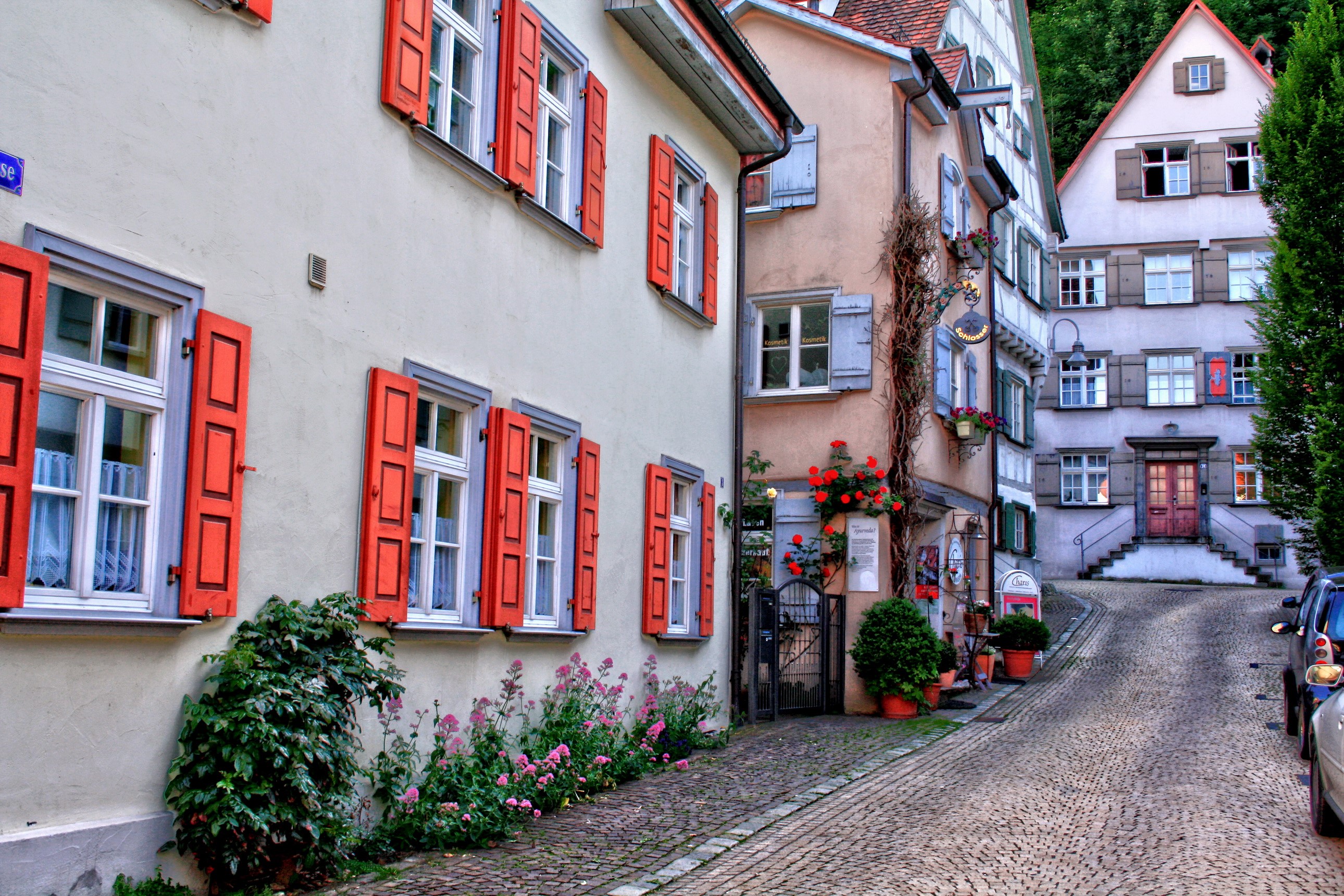 Cobblestone street with historic buildings in Germany HD Wallpaper