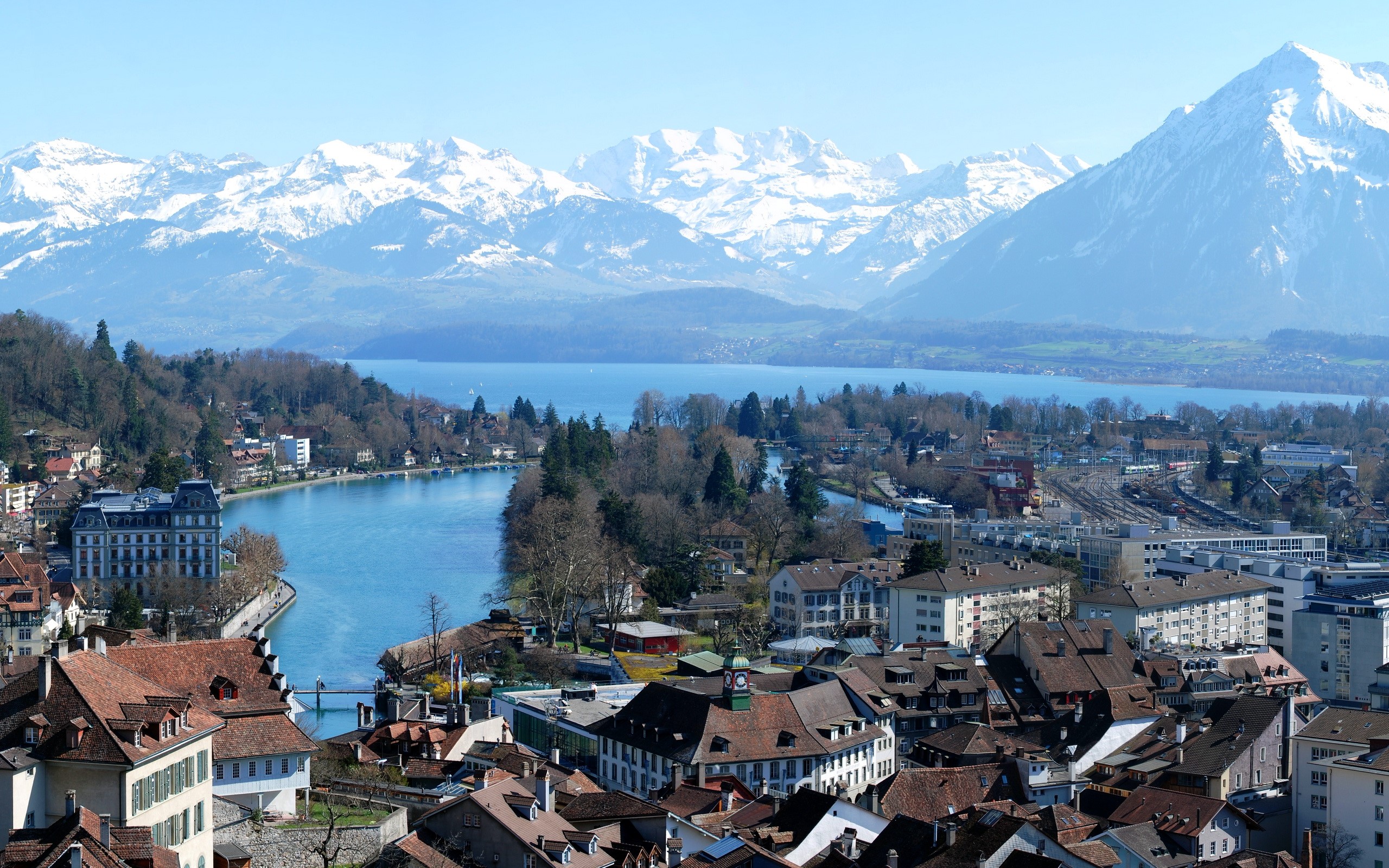 Cityscape with Lake and Snow-Capped Mountains in Switzerland HD Wallpaper