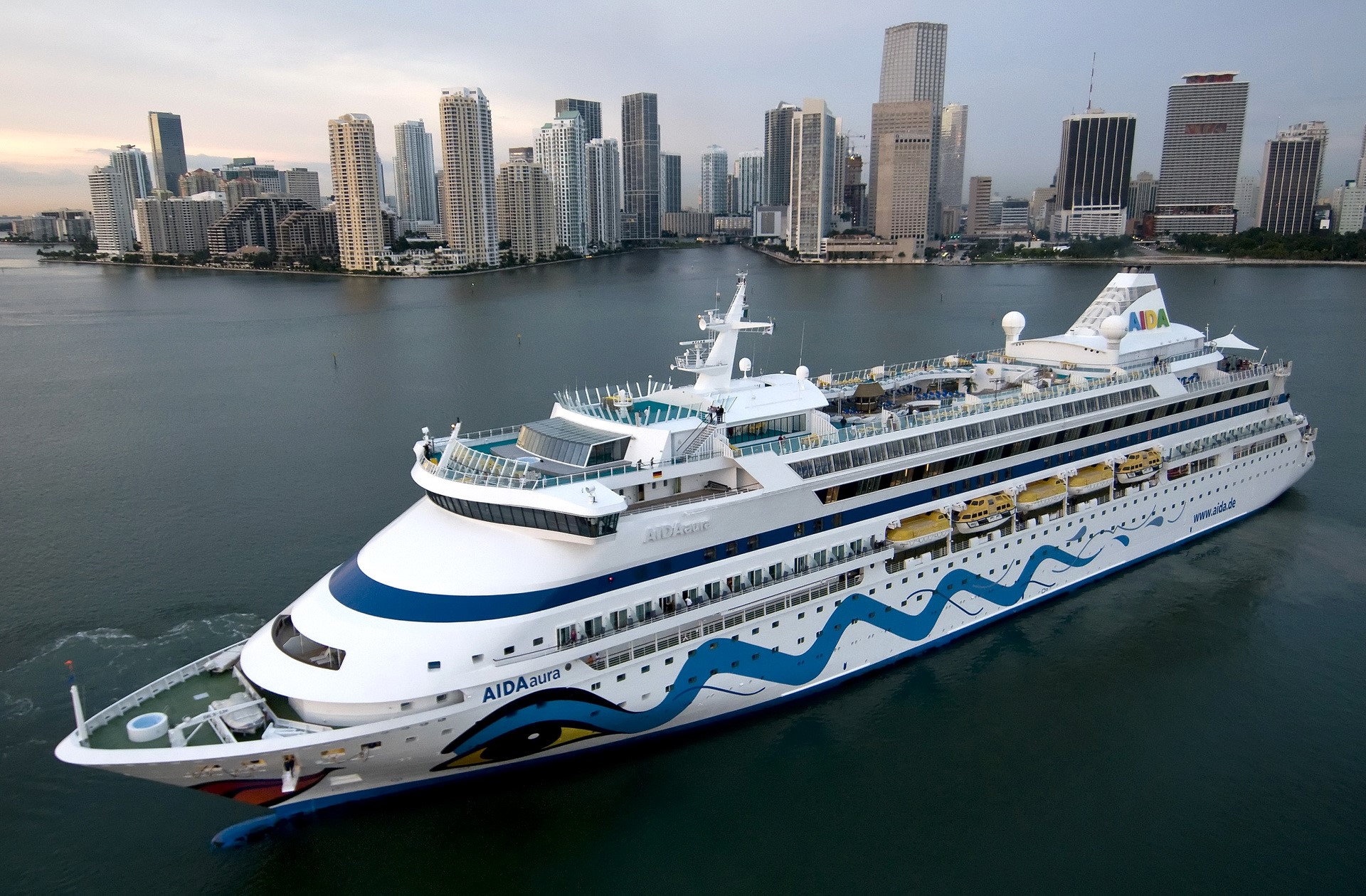 AIDAaura cruise ship sailing by Miami skyline HD Wallpaper