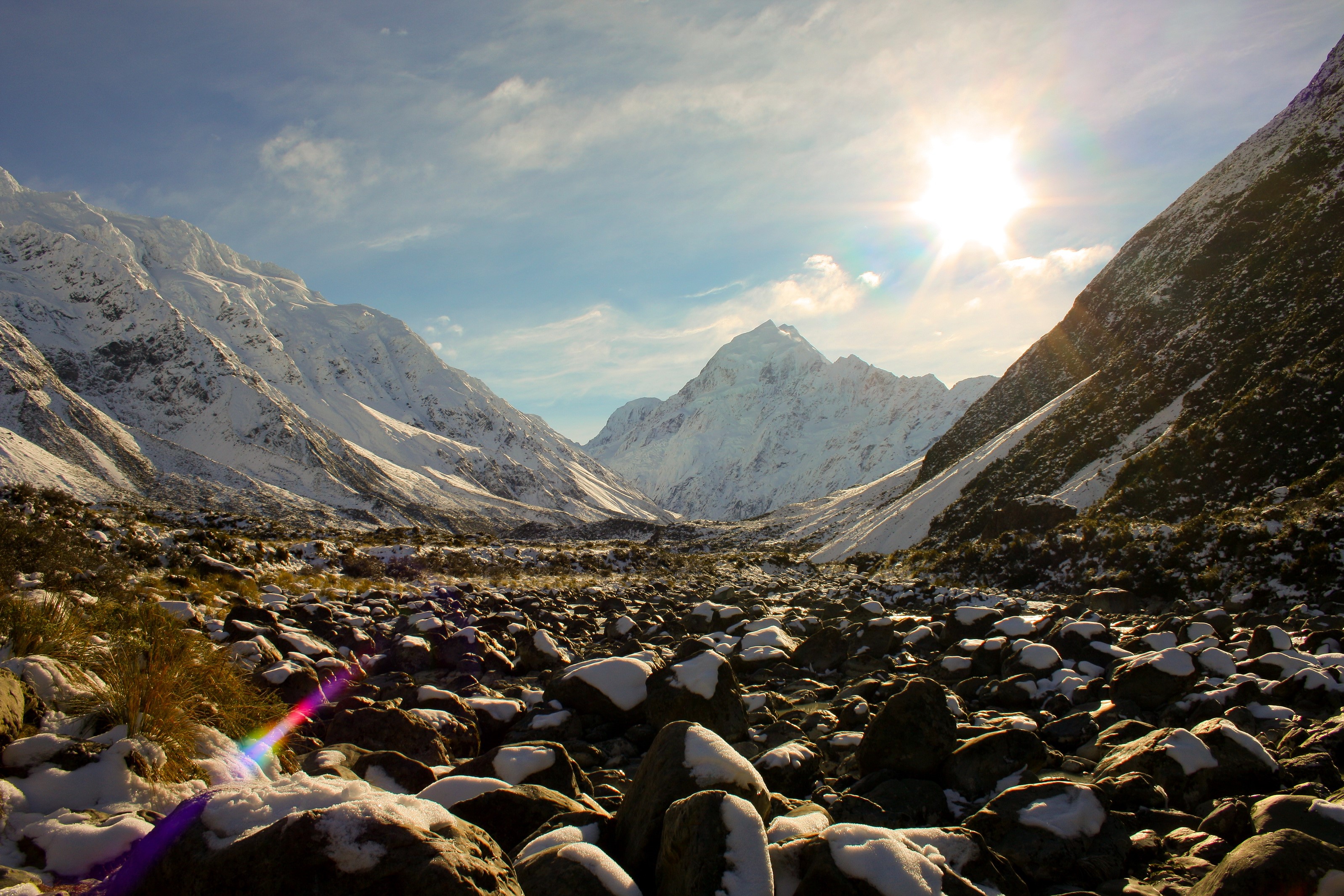 Snowy Mountains Valley with Sun HD Wallpaper