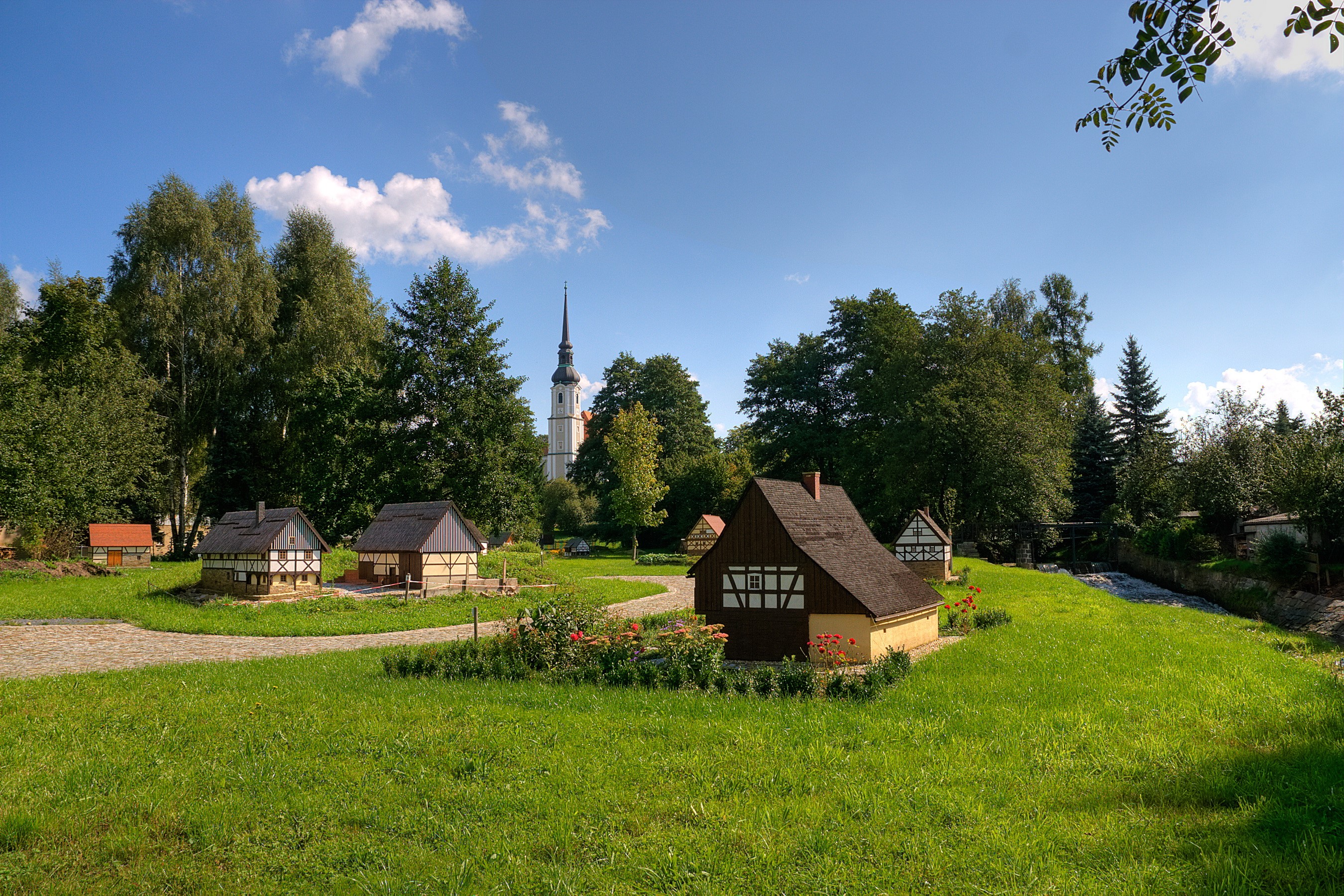 Miniature village with church in the background HD Wallpaper