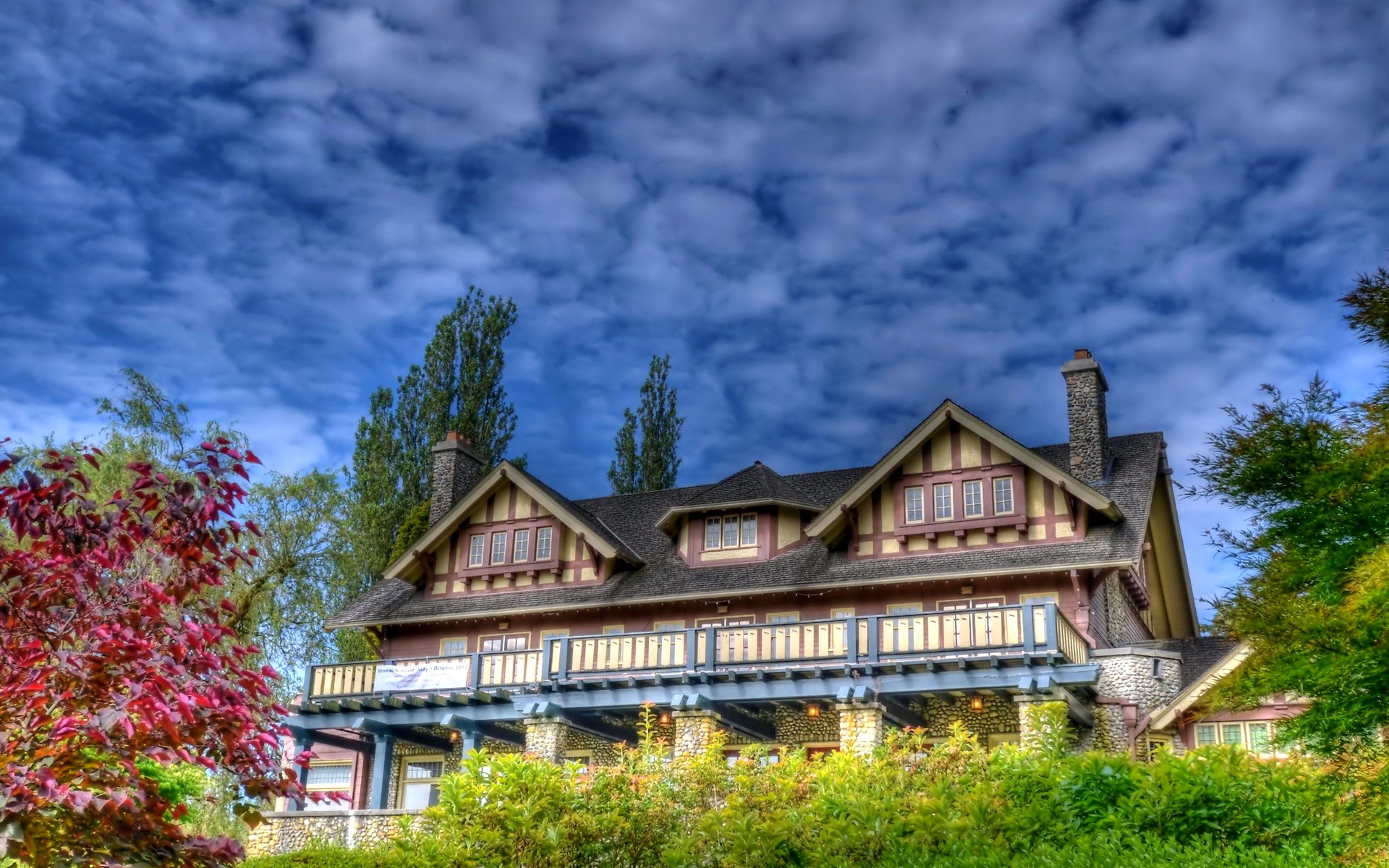 Craftsman style house with red foliage and blue sky HD Wallpaper