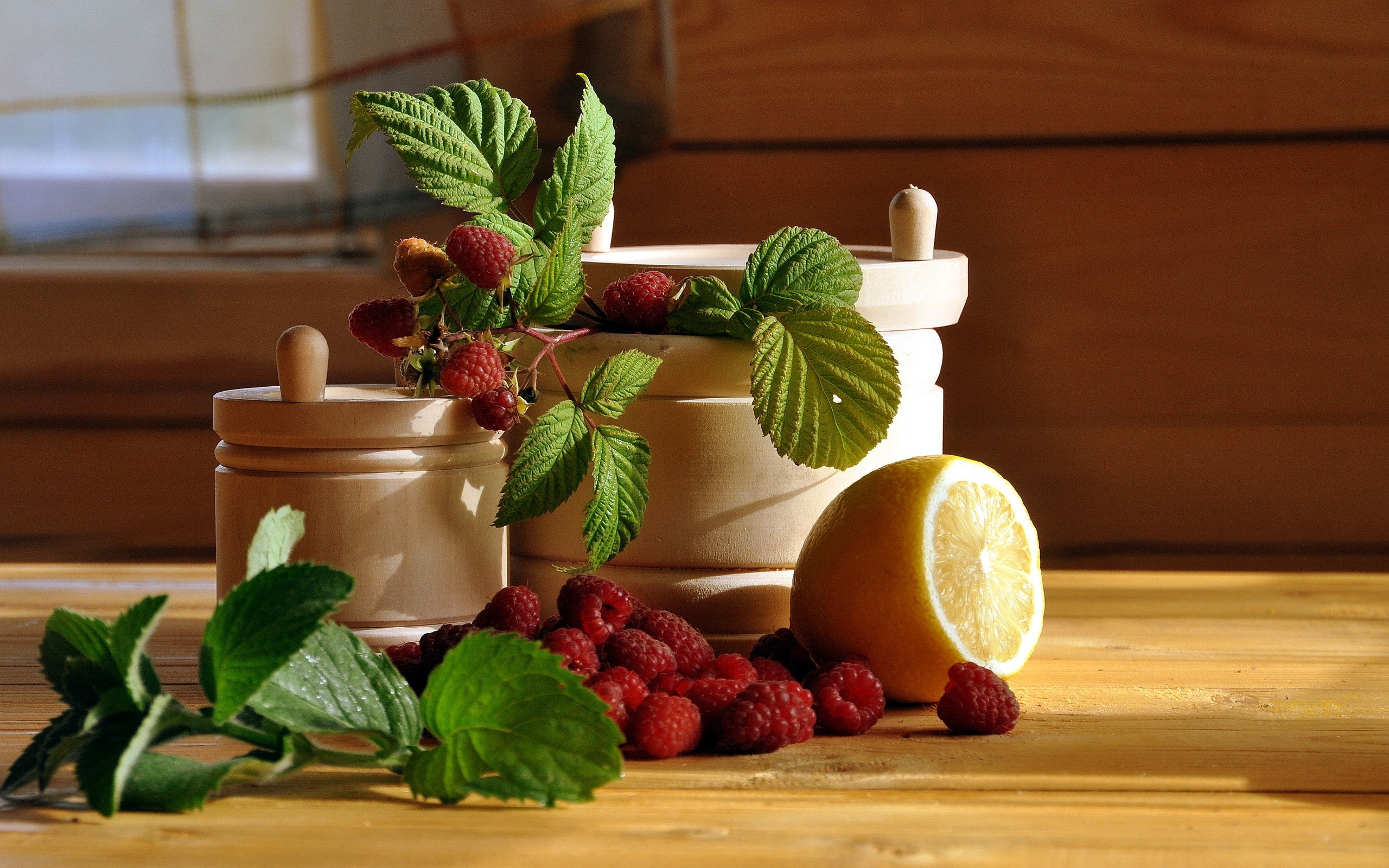 Raspberries, mint, lemon, and wooden jars HD Wallpaper