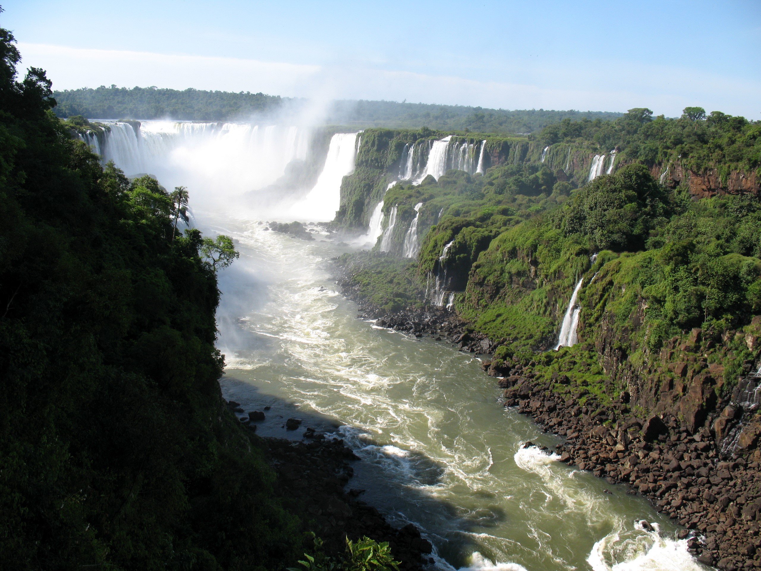 Iguazu Falls with lush green surroundings HD Wallpaper